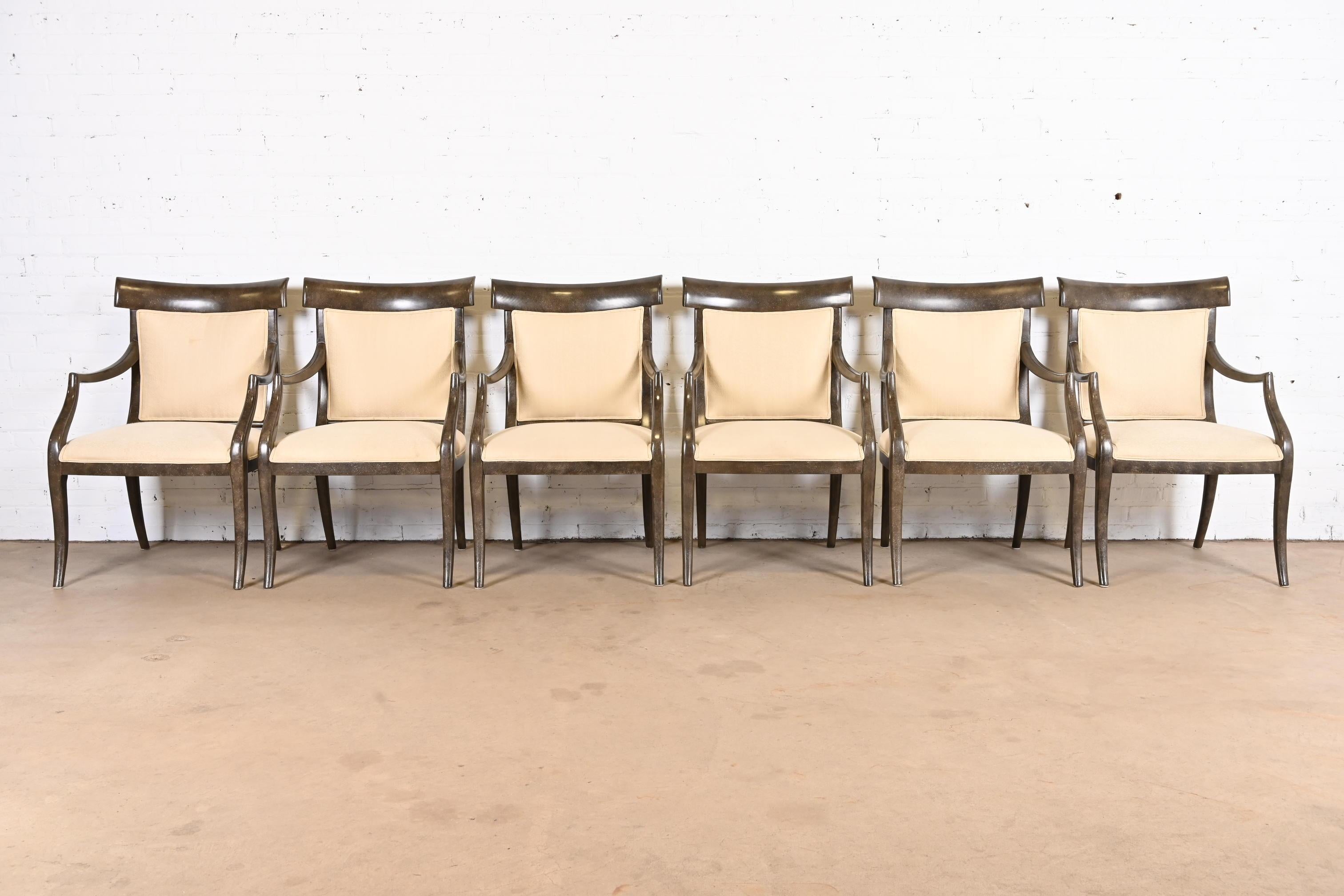 
A gorgeous set of six modern Regency style dining armchairs
By Ferguson Copeland
USA, Late 20th century
Elegant carved wood frames in gray finish, with cream upholstered seats and backs.
Measures: 23.75
