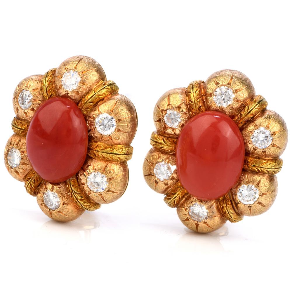 These Ellegant vinatge earrings are crafted in finely textured 18K yellow gold By Feriozzi. They are centered with oval shape caboushion genuine red Coral measuringng 12mm x 10mm Set within finely chiseled matted yellow gold frames. Coral Are