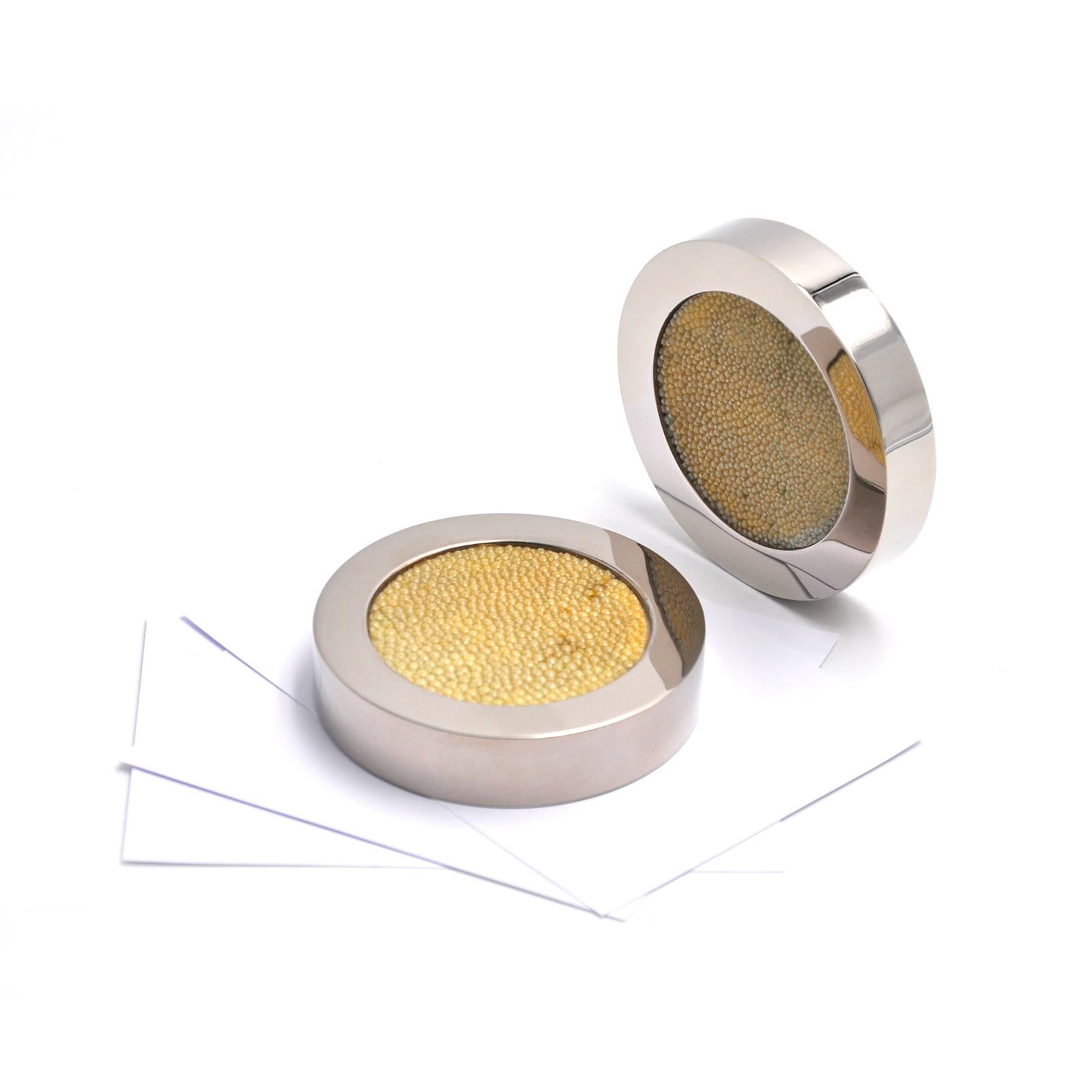 Add a touch of elegance to your desk with this unique paperweight made of shagreen galuchat leather, a fine and exquisite material known for its unique texture composed of tiny bead-like grains. 
A luxury accessory with a modern design, inspired by