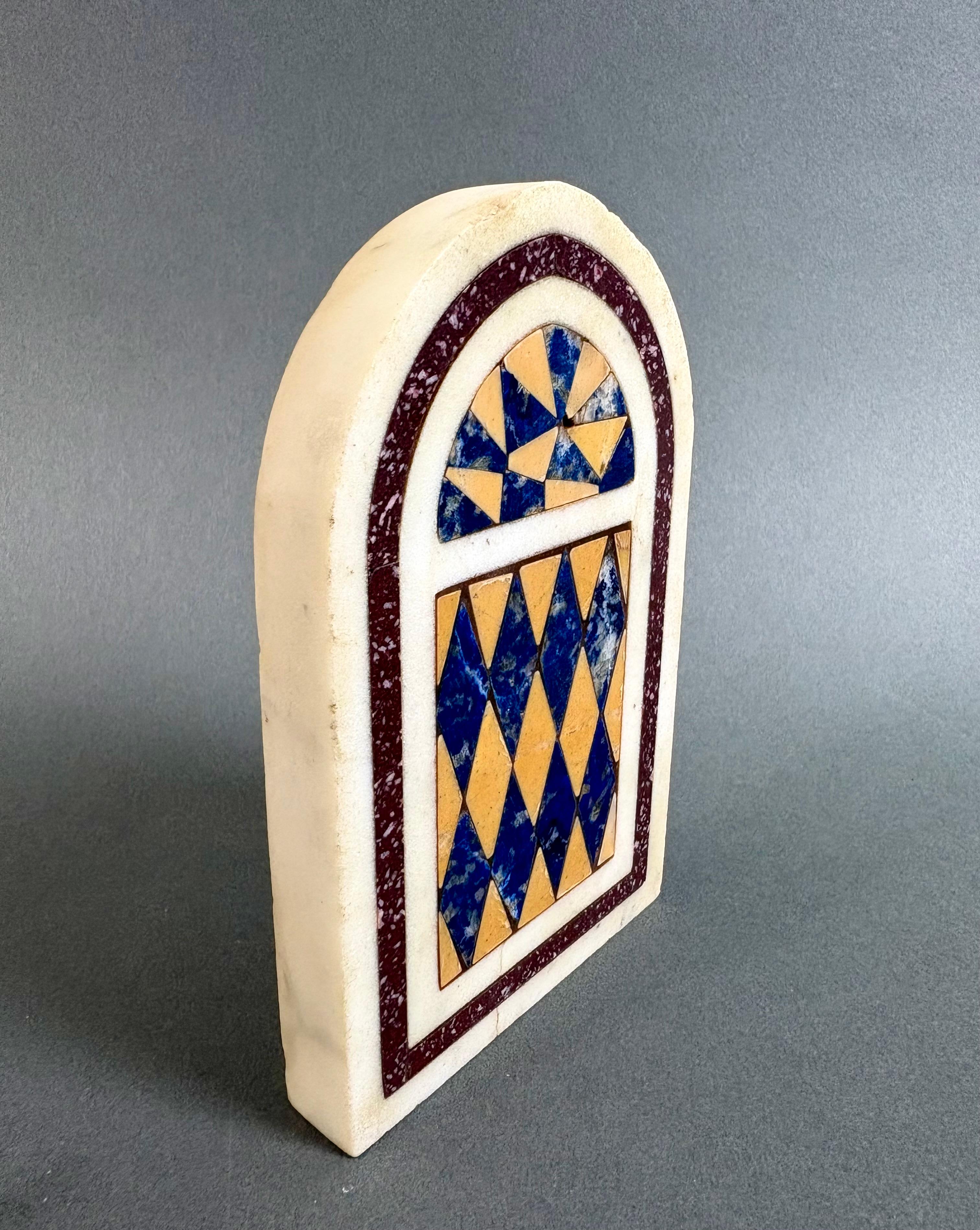 Precious marble and gemstone paperweight, souvenir of the Grand Tour, Rome, 19th century. Made of white Carrara marble with geometric inlays of porphyry, antique yellow marble, and lapis lazuli.   

The Grand Tour is a kind of secular pilgrimage,