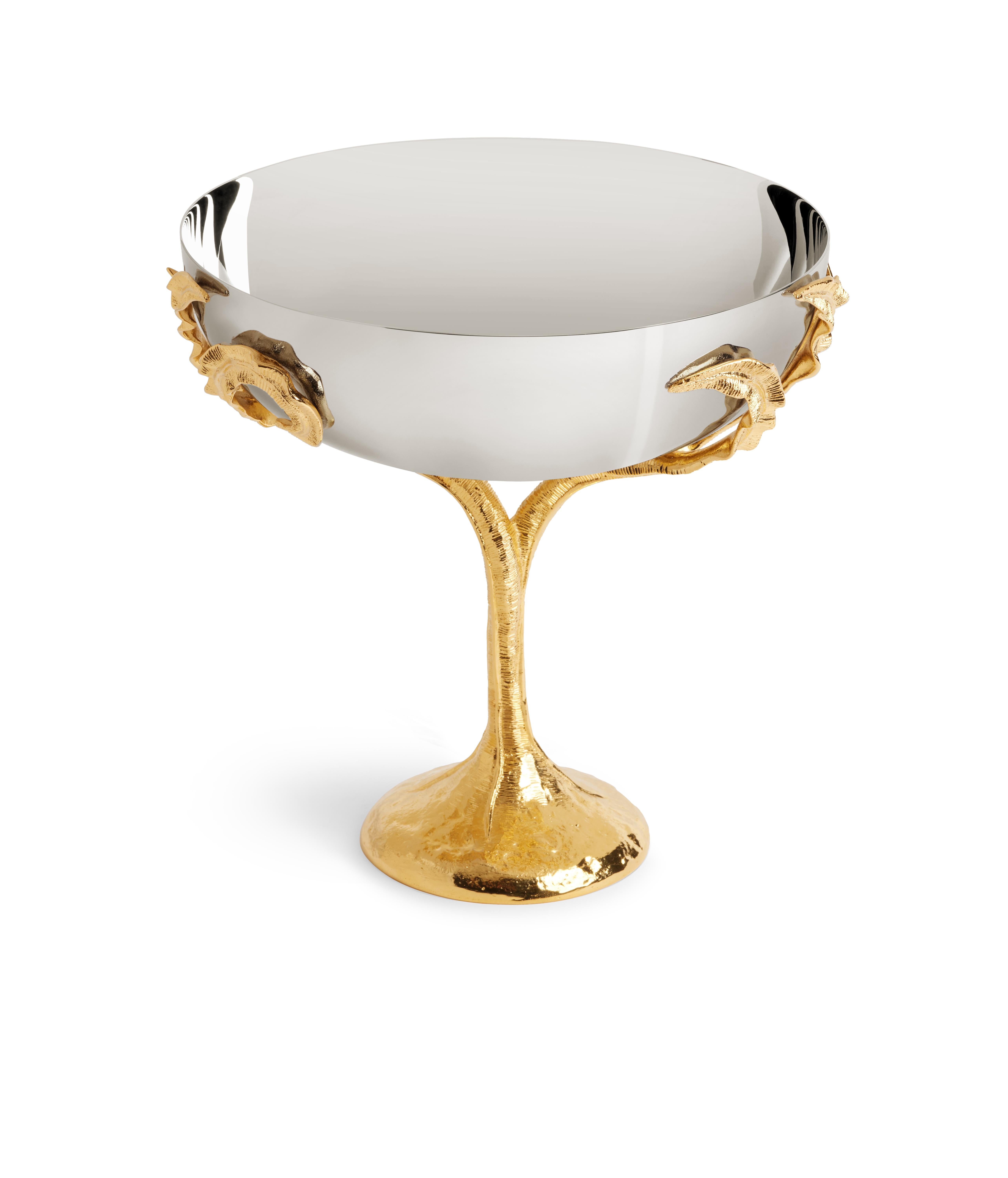 An ensemble of eight pieces that embodies elegance and craftsmanship. Each piece, meticulously crafted from stainless steel and adorned with 24k gold-plated accents, features a dynamic hand-sculpted fern motif showcasing the unparalleled talent of