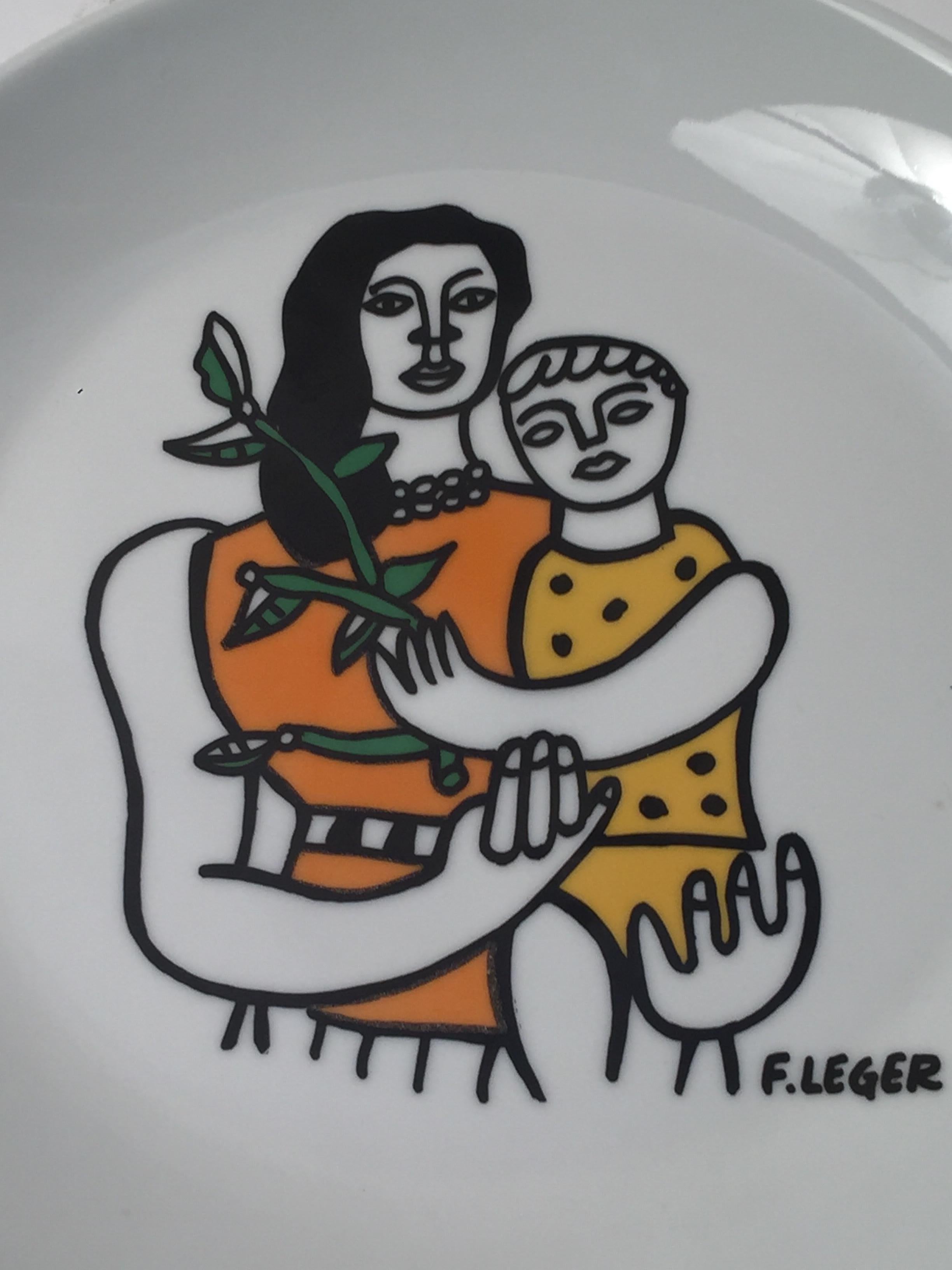 Plate with image after Fernand Leger featuring a mother and her child holding a plant. In excellent condition.