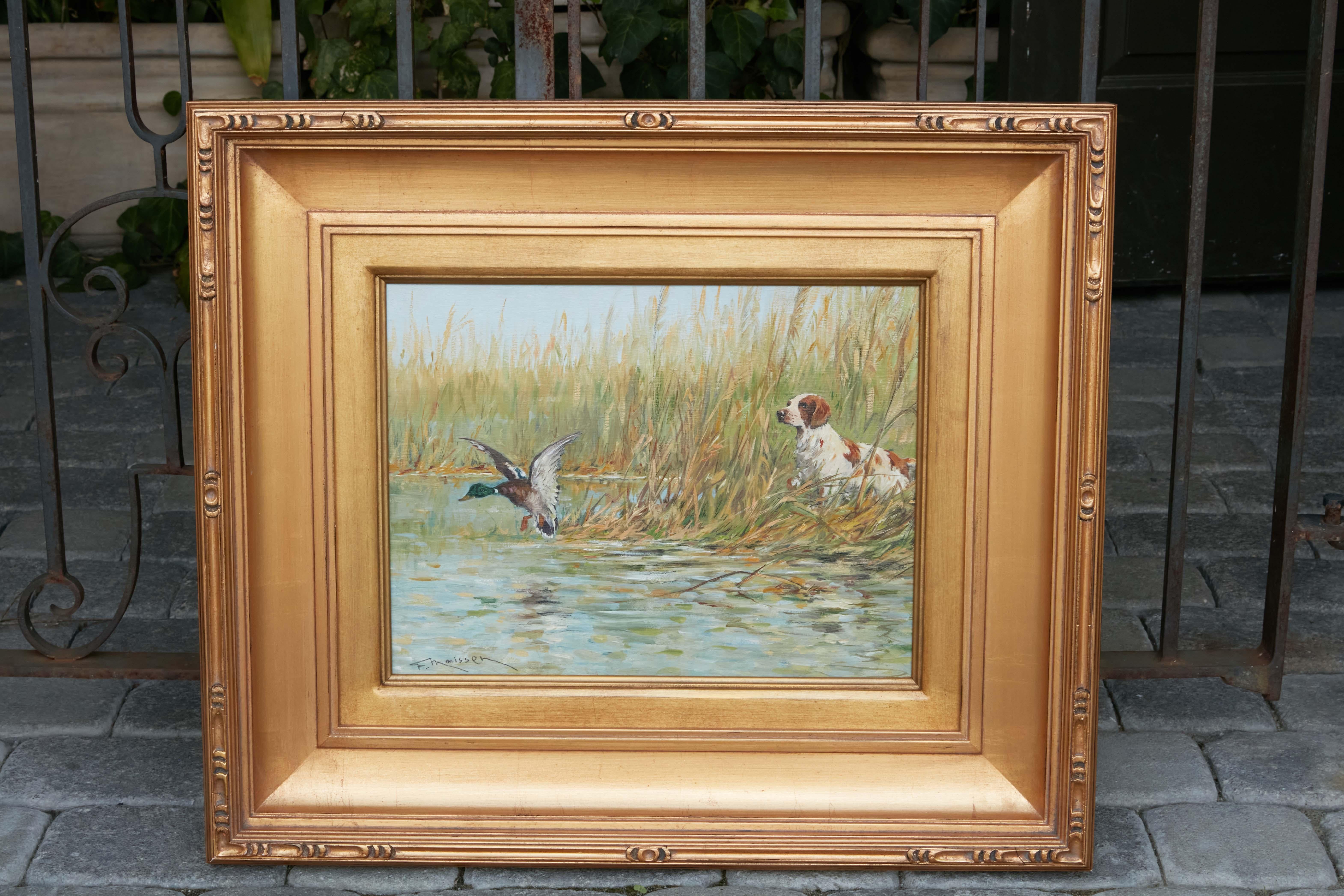 A French oil on panel painting by Fernand Maissen from the early 20th century, depicting a sporting dog hunting a duck. Created in the early years of the 20th century by French artist Fernand Maissen, this horizontal oil on panel painting depicts a