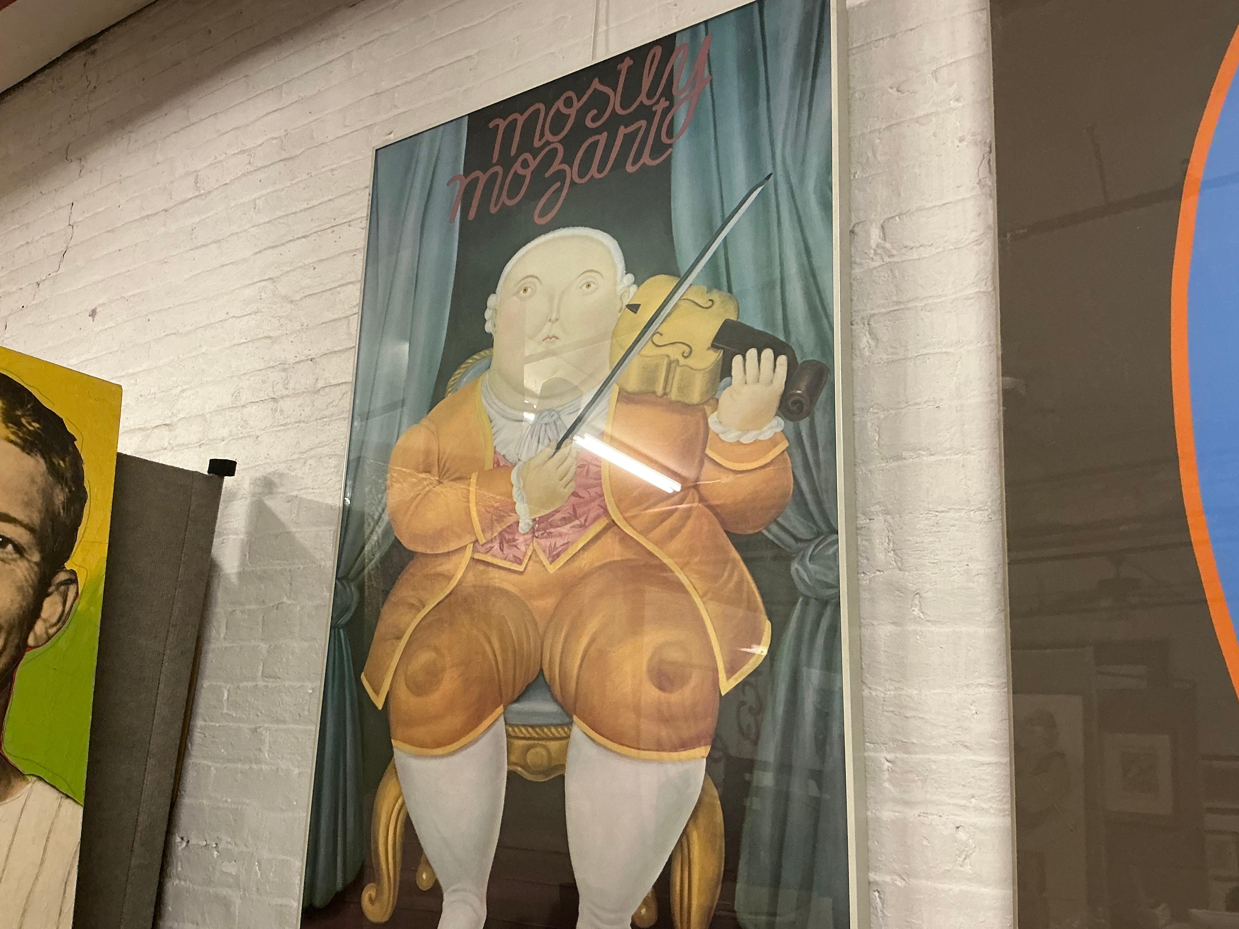 This original poster by Fernando Botero, created for the Mostly Mozart festival and published by the Lincoln Center for the Performing Arts, exemplifies Botero's signature humor and playful distortion. The artwork features a rotund musician seated