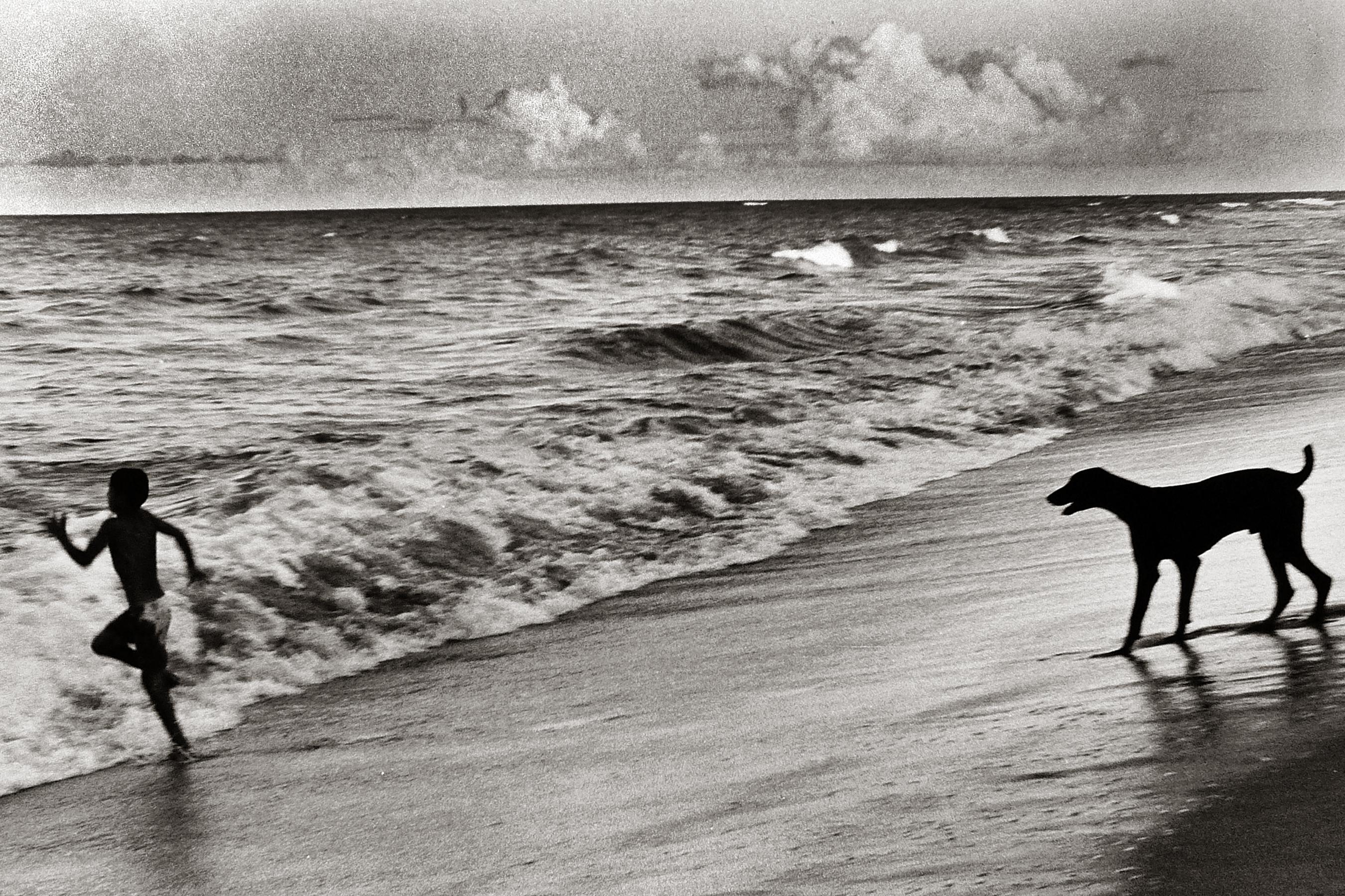 Fernando Natalici Black and White Photograph - Bahia Brazil Photograph (Boy and Dog, Summer)