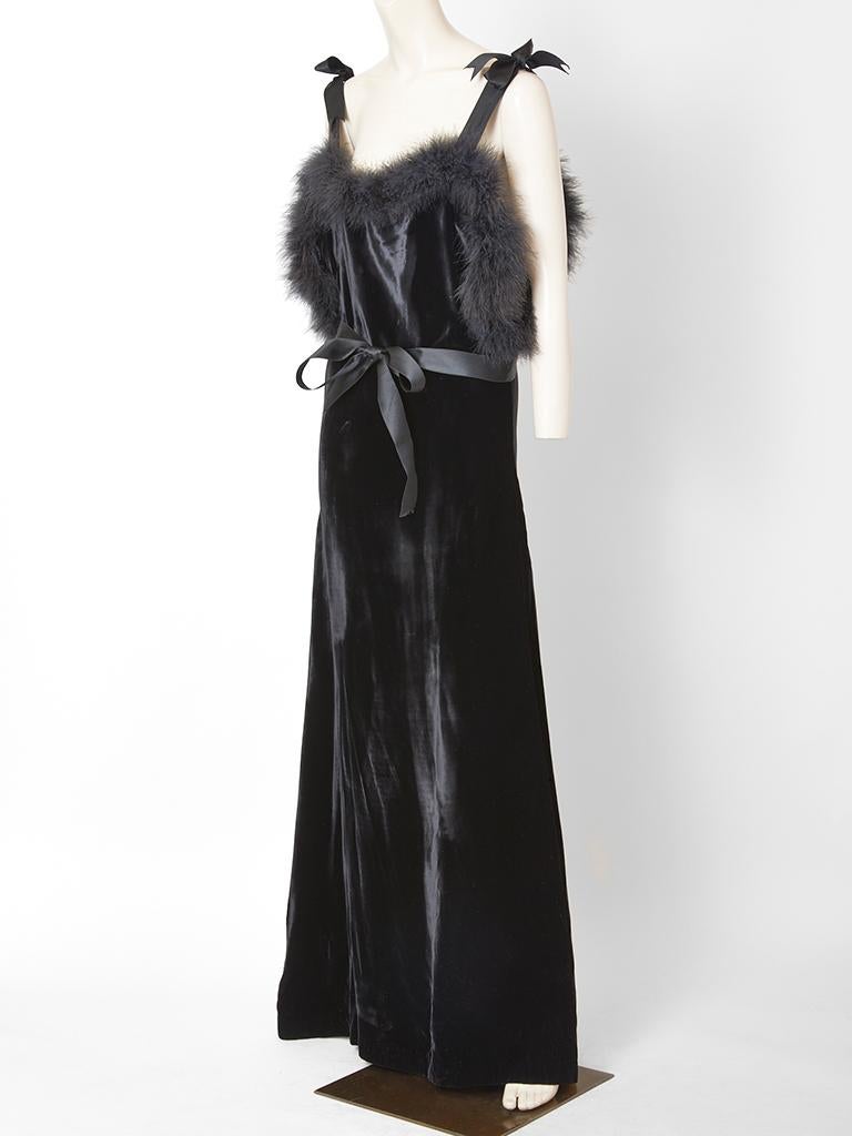 Fernando Sanchez, soft silouette, velvet evening dress, having Satin straps with bows at the shoulders and Maribou trim along the upper bust, underarm and back. Dress ties at the waist with a Satin sash. 
