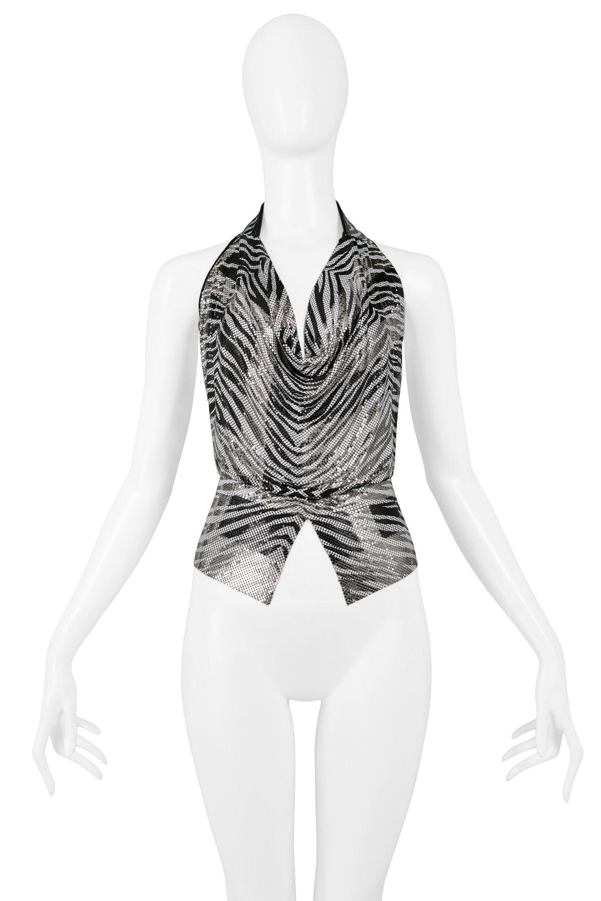 Resurrection Vintage is excited to offer a vintage Anthony Ferrara handmade black and white zebra print chainmail metal halter top with leather straps, and diamond cutout front hem. The cowl neckline is adjustable and can be worn low or high. Circa