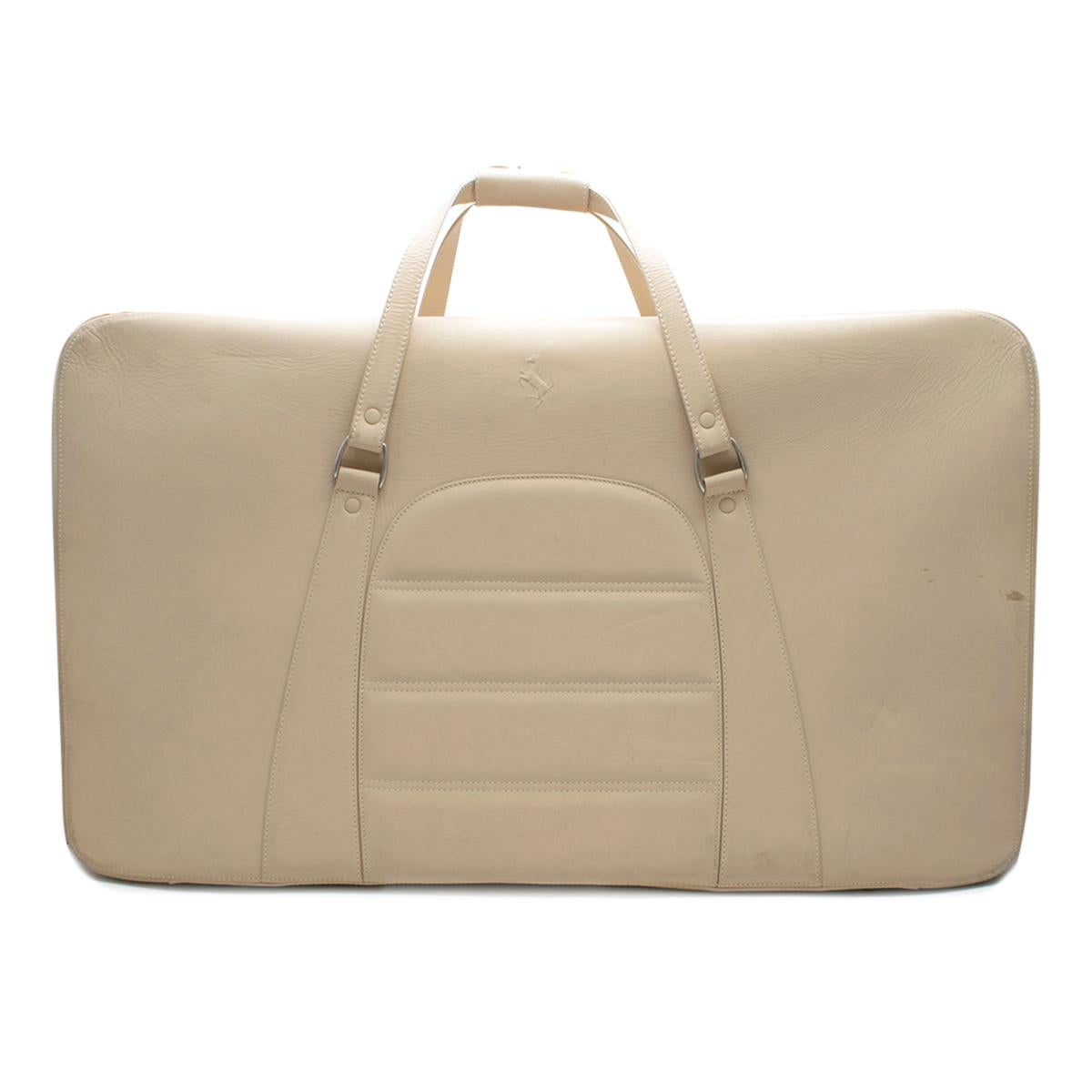 Ferrari Beige Large Leather Suitcase

Custom made Ferrari nude suitcase with a zip fastening. straps inside to hold the clothing in place and protective studs on the bottom. 

Please note, these items are pre-owned and may show signs of being stored
