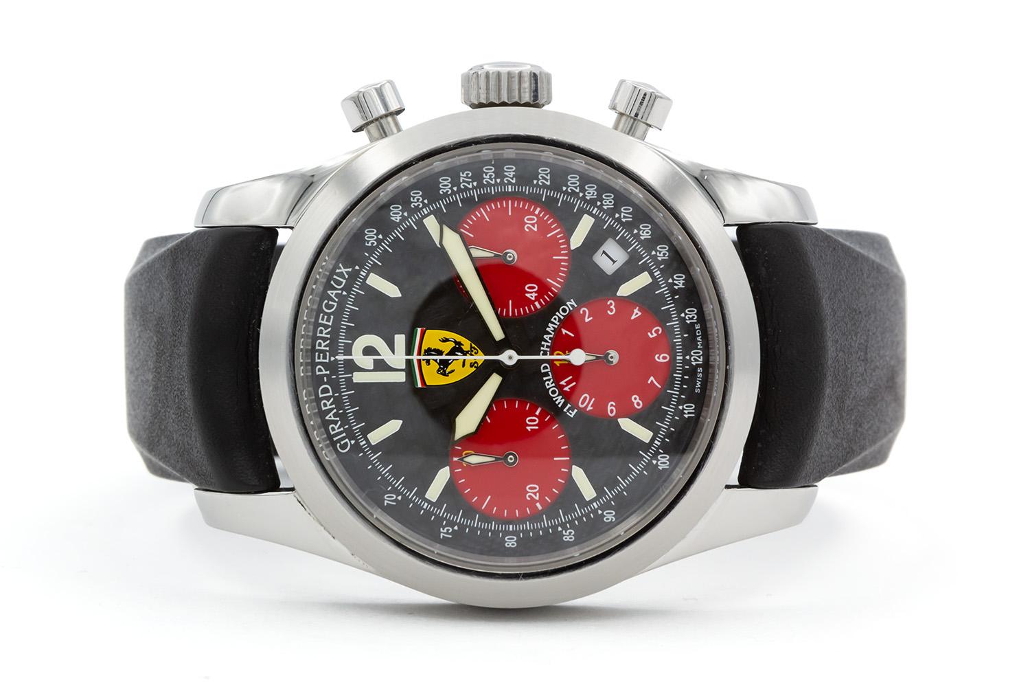 We are pleased to offer this Girard Perregaux Ferrari F1 2002 Championship Chronograph Watch 40mm Ref. 4956. This watch features a stainless steel 40mm case, black carbon fiber dial with red sub dial and date aperture at 4:30, black rubber strap,
