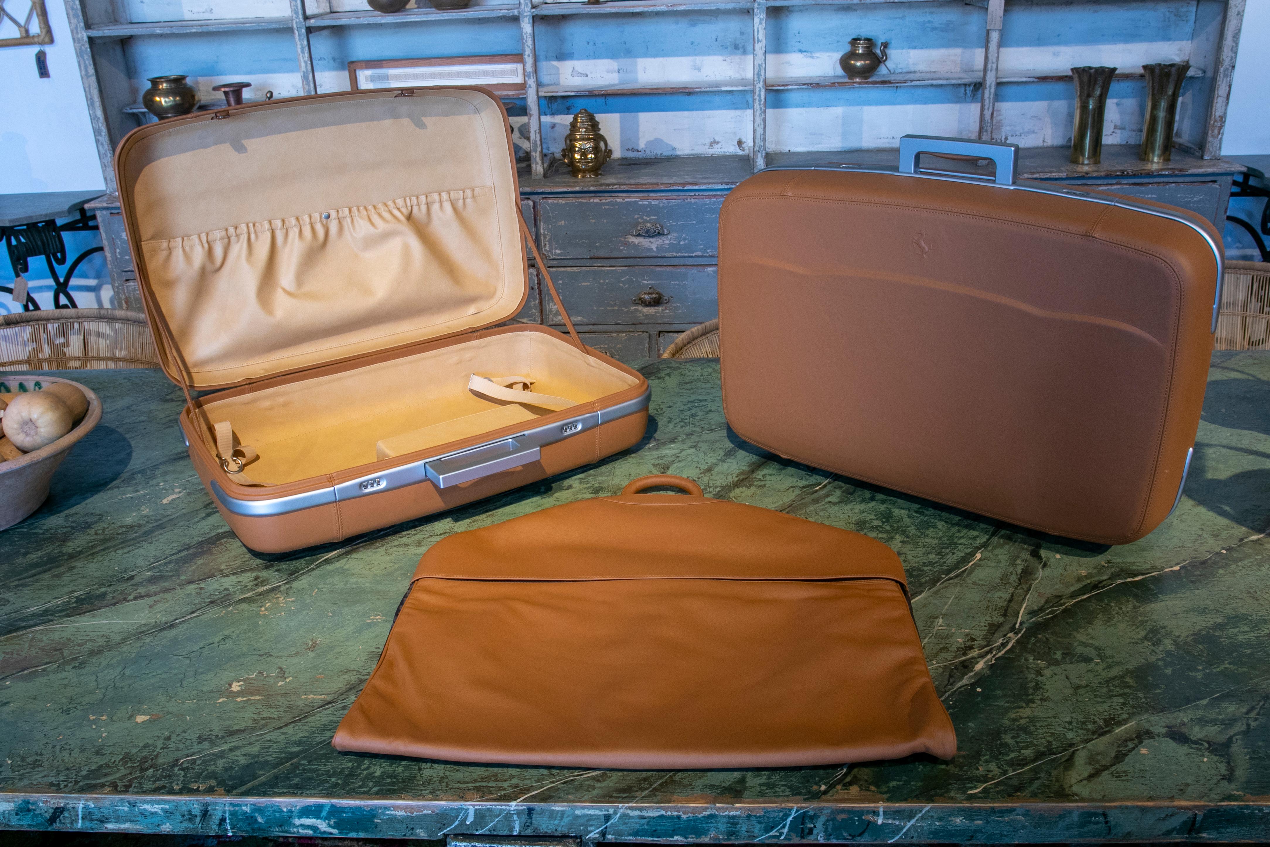 Ferrari suitcase set manufactured by Schedoni in tan leather and aluminium.
Brand new with original cases.