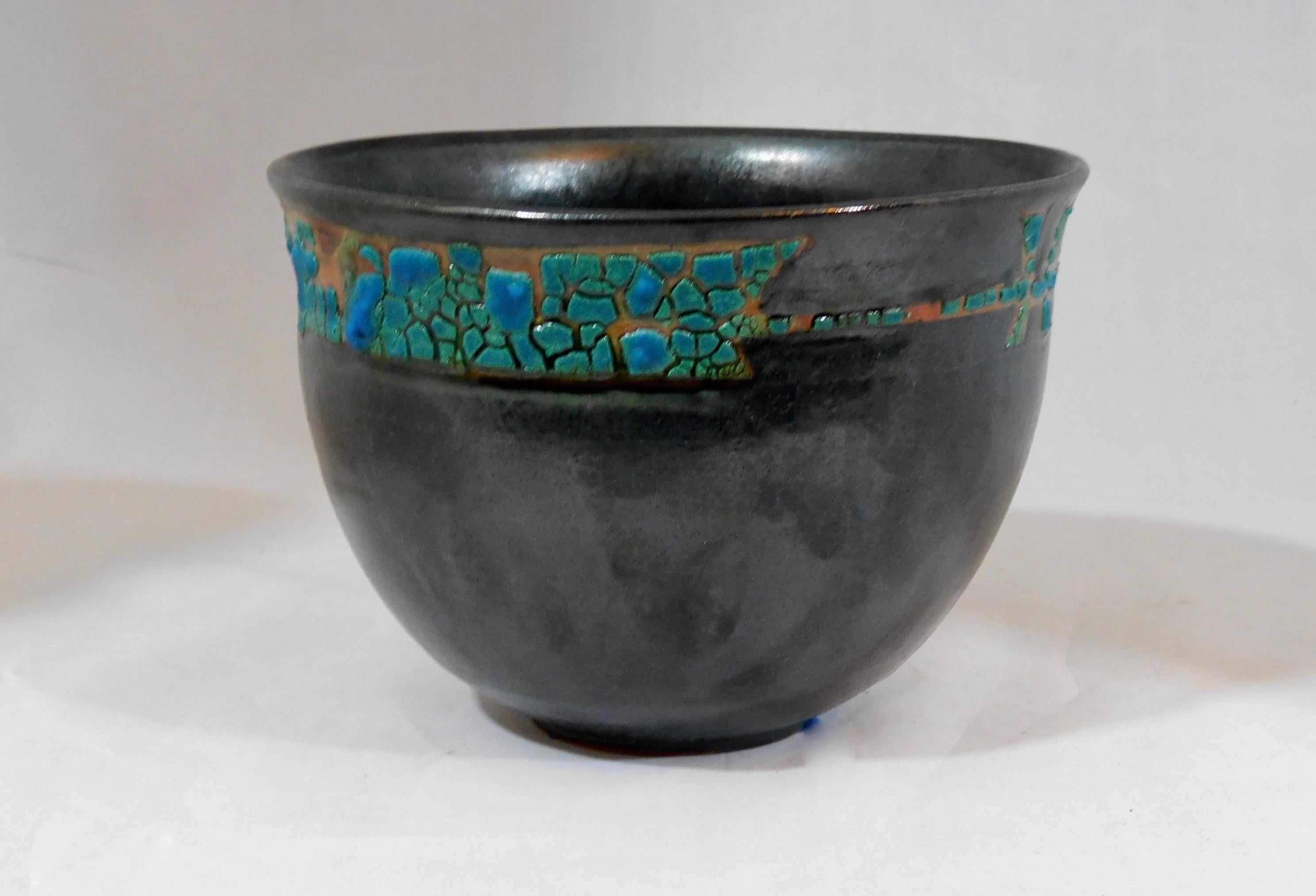 Ferrera wheel thrown earthenware vessel by ceramicist Andrew Wilder.
This is a one of a kind object made in the ancient way- by hand in a small artisanal pottery. In this series Wilder explores the application of lichen under glazes to achieve