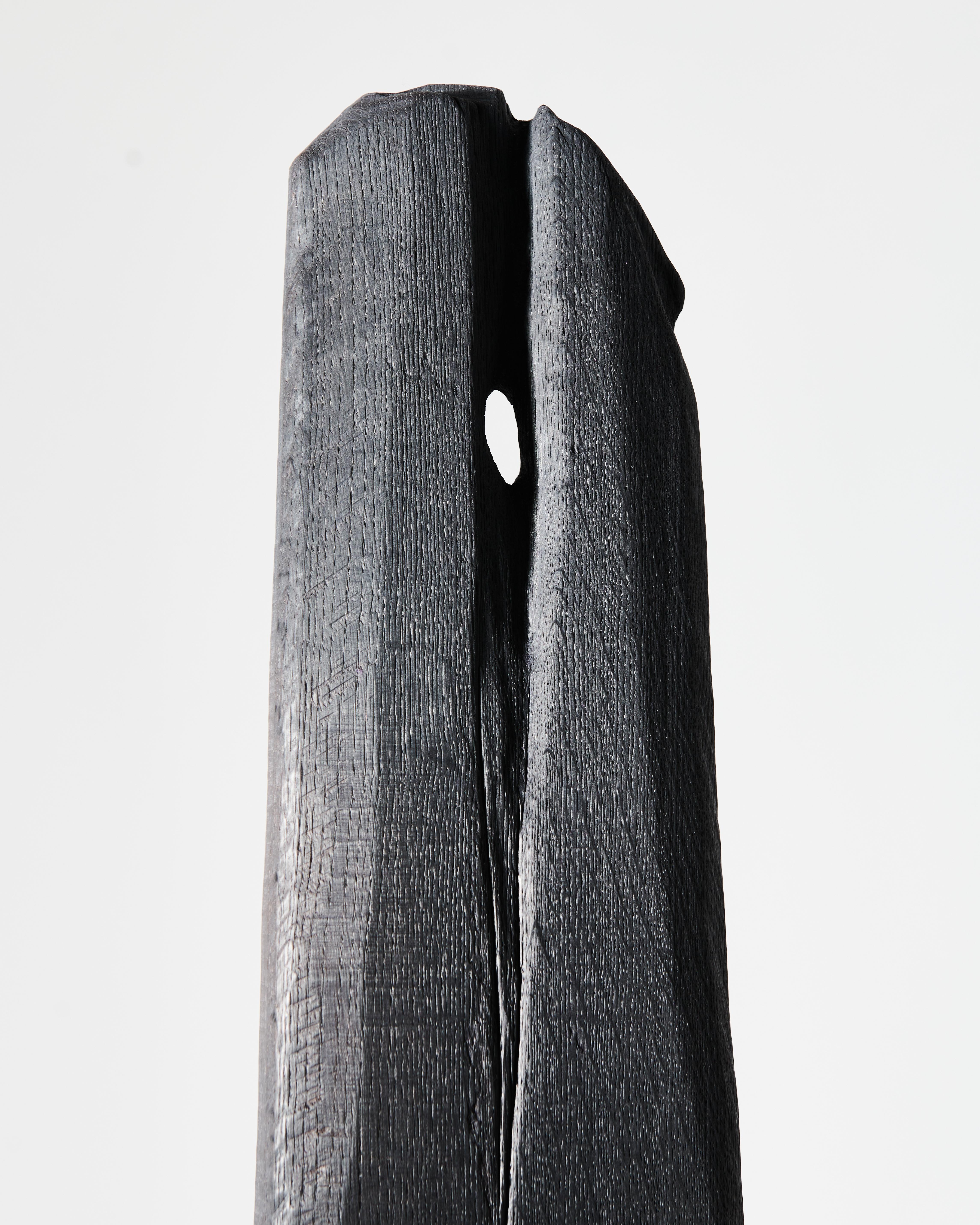 Archaic stool in solid wood burnt with shou sugi ban technique with bronze details 

