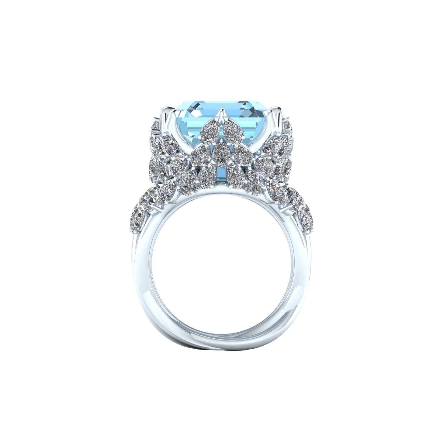17.40 carat Blue Emerald cut Aquamarine gemstone, of a high quality intense blue, transparent mineral with no inclusions, great cut's quality adorned by approximately 4.7 carats of bright F/G color, VS clarity Pear shape diamonds.
The ring is