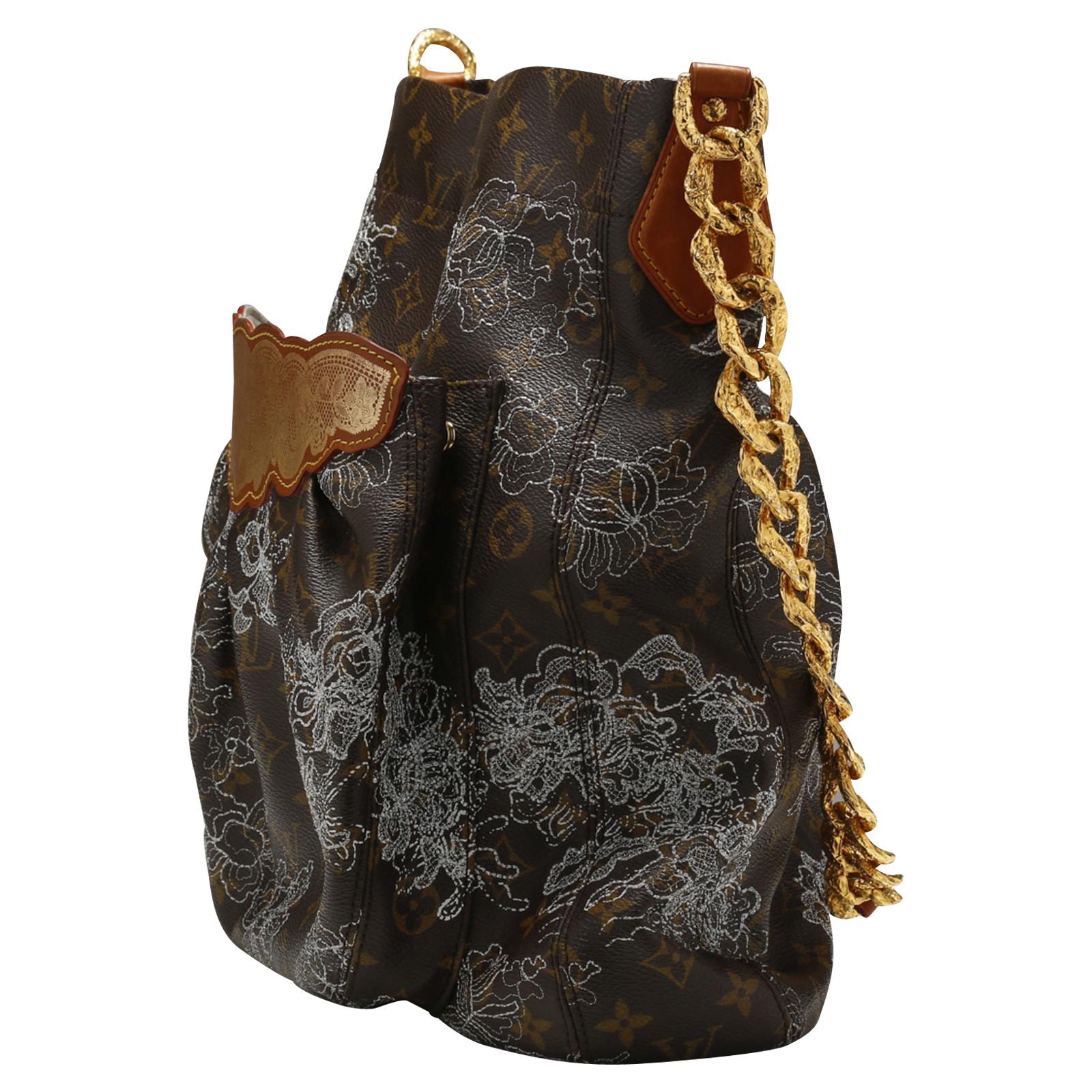 Louis Vuitton bag, Fersen Dentelle model (spring-summer 2007), super limited edition, in printed Monogram canvas embroidered with lace of silver metallic threads depicting a flower decoration, alcantara lining, chain shoulder strap in gilt metal.