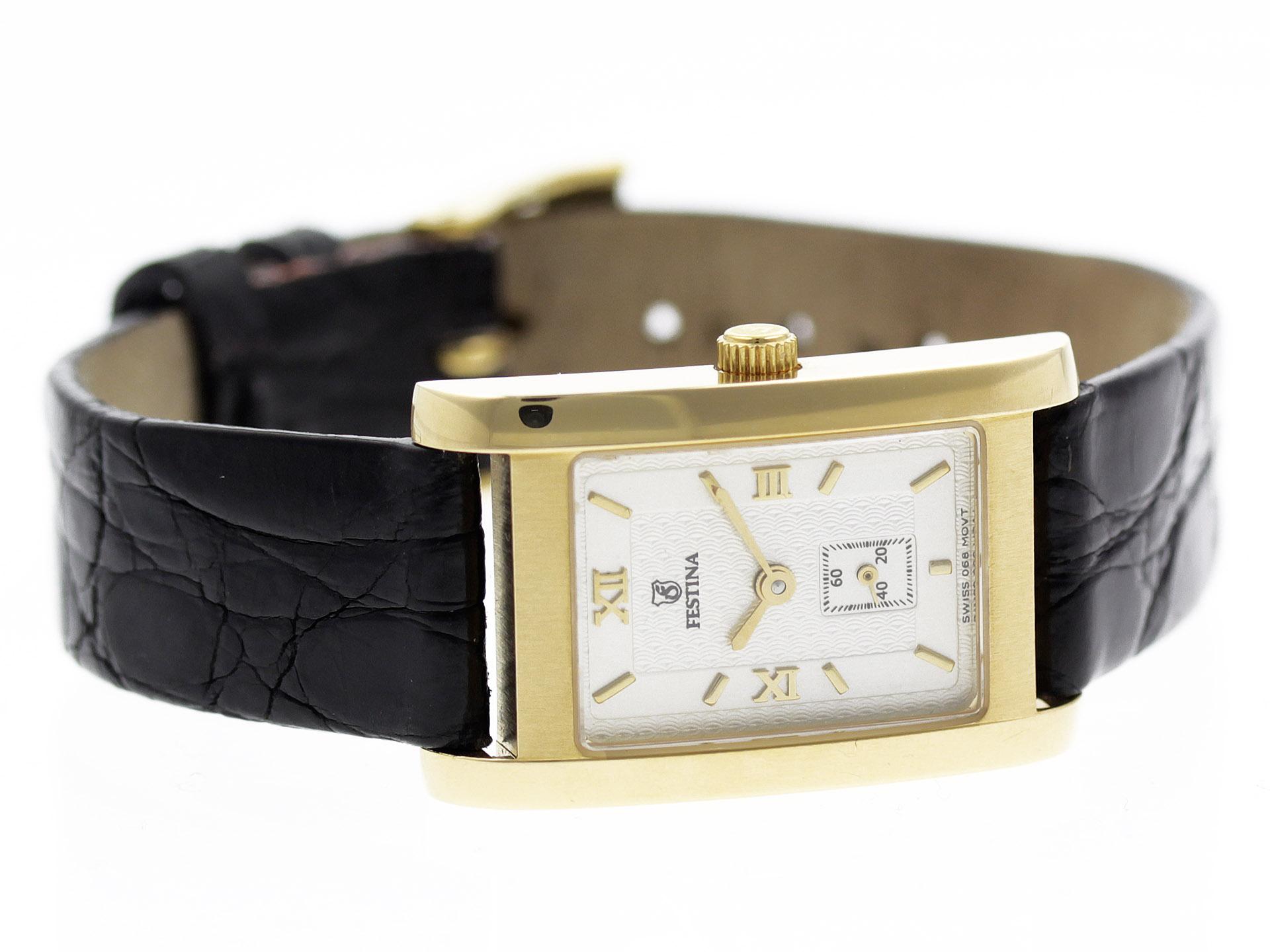 18K Yellow Gold Vintage Festina Tank watch, water resistance to 30m, with black leather strap.

Watch	
Brand:	Festina
Series:	Tank
Model #:	N/A
Gender:	Ladies’
Condition:	Excellent Condition Gently Pre-owned, Light Scratches on Case, Original Strap