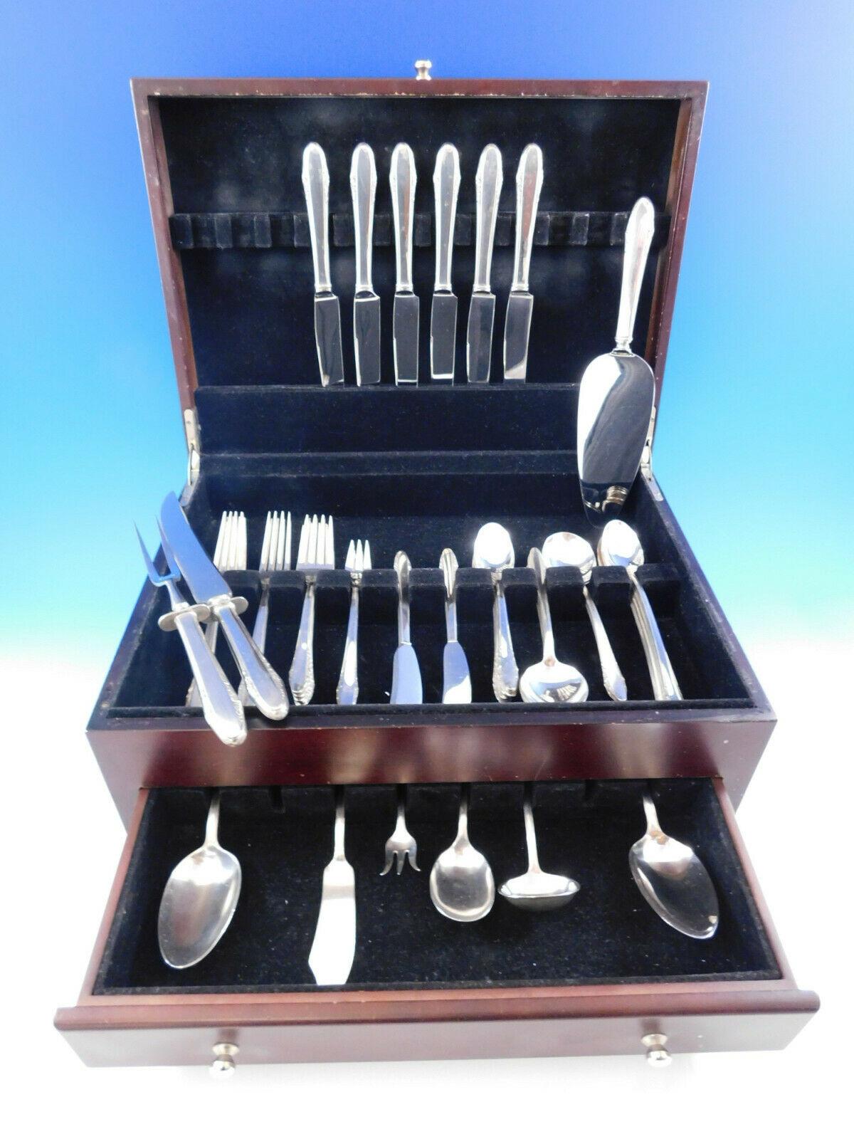 Festival by Lunt, circa 1936, sterling silver flatware set, 57 pieces. This set includes:

6 knives, 8 7/8