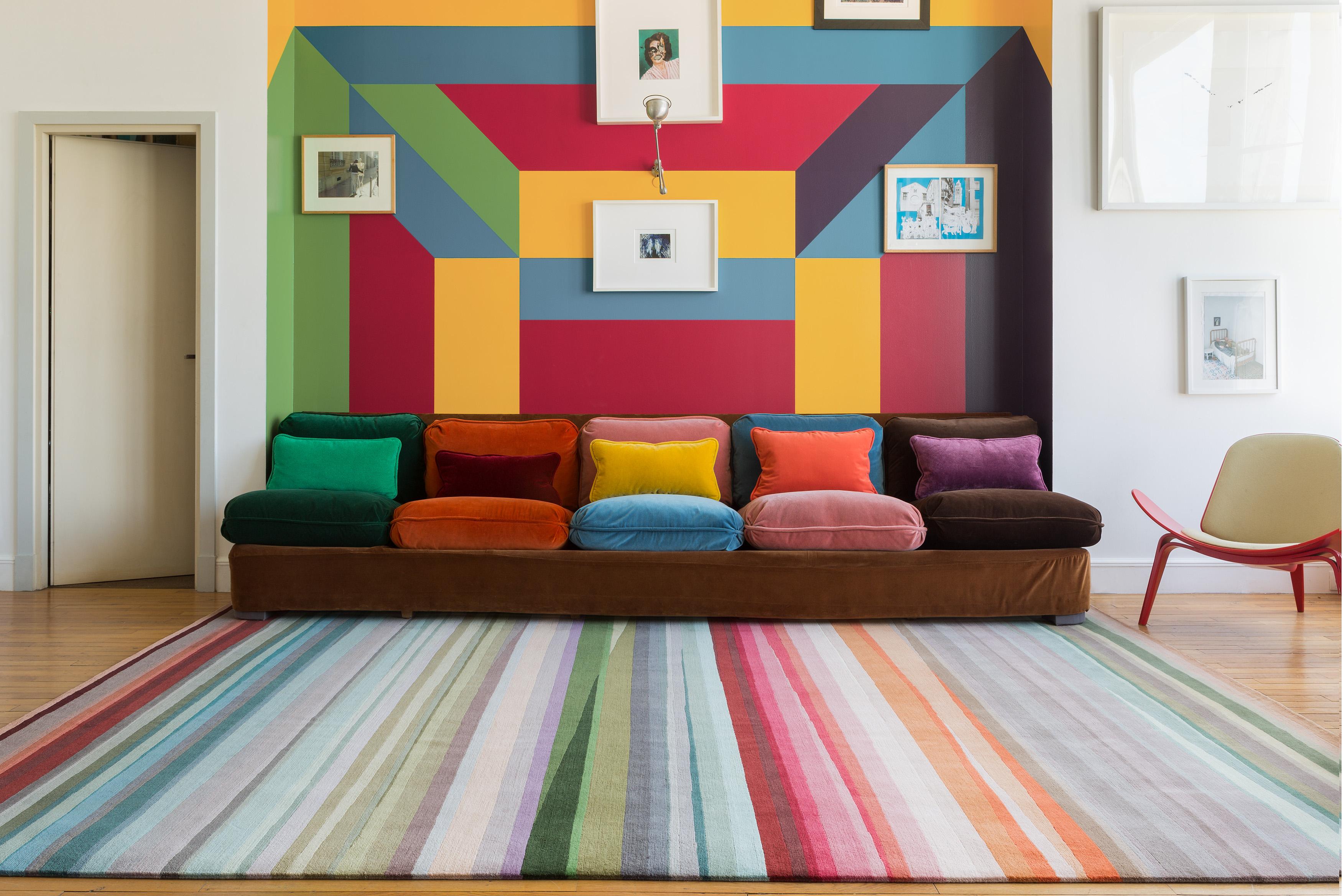 The Festival rug is instantly recognizable as the work of Sir Paul Smith. The Classic stripe is given a contemporary twist with intersections and overlays, seamlessly flowing from one color group to the next. The impactful and uplifting design