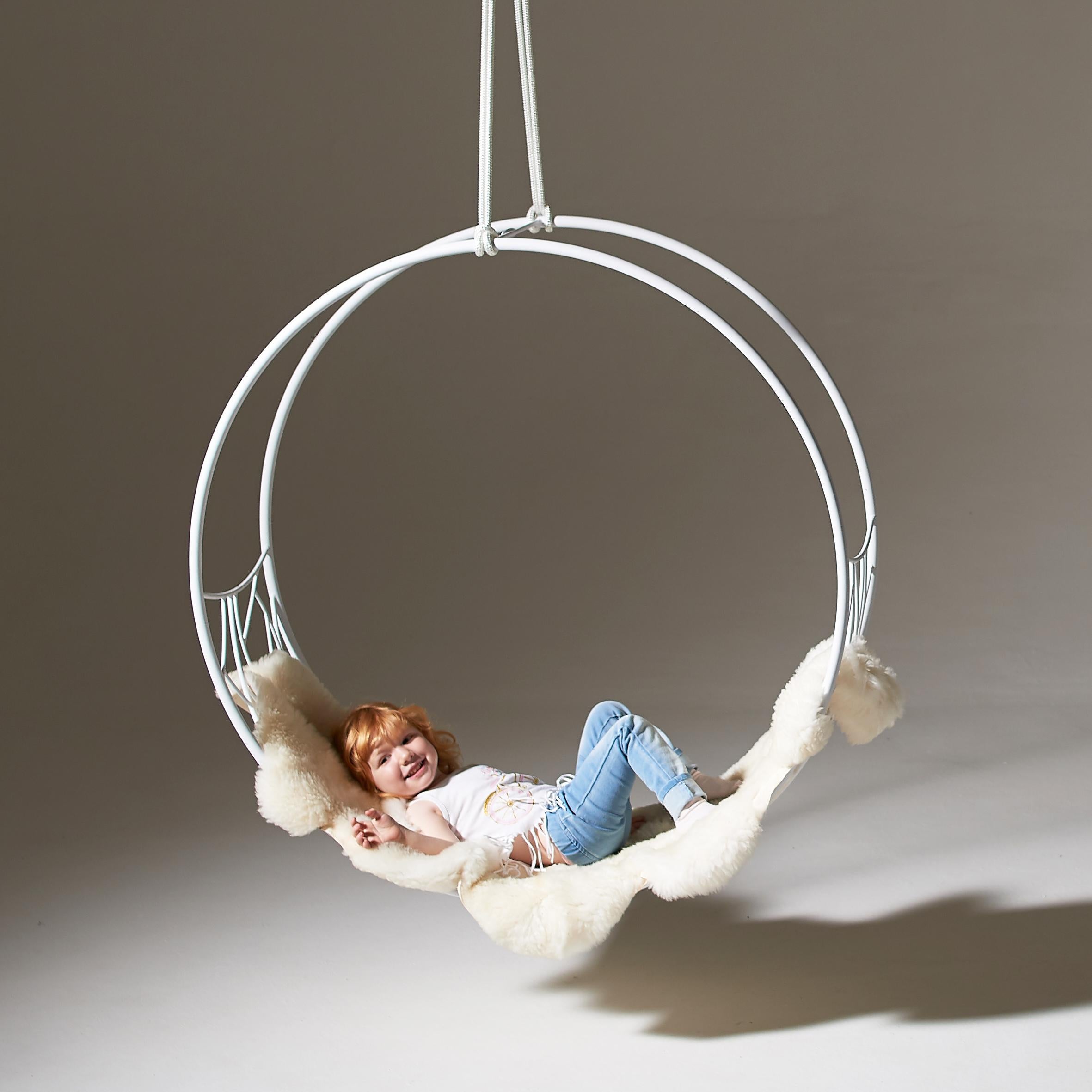 The Wheel swing seat is sculptural and dynamic. Its striking circular shape lends itself for use as a functional art piece.
The chair has an open yet enveloping feel. 
The pattern detail is inspired by nature and reminiscent of the veins in