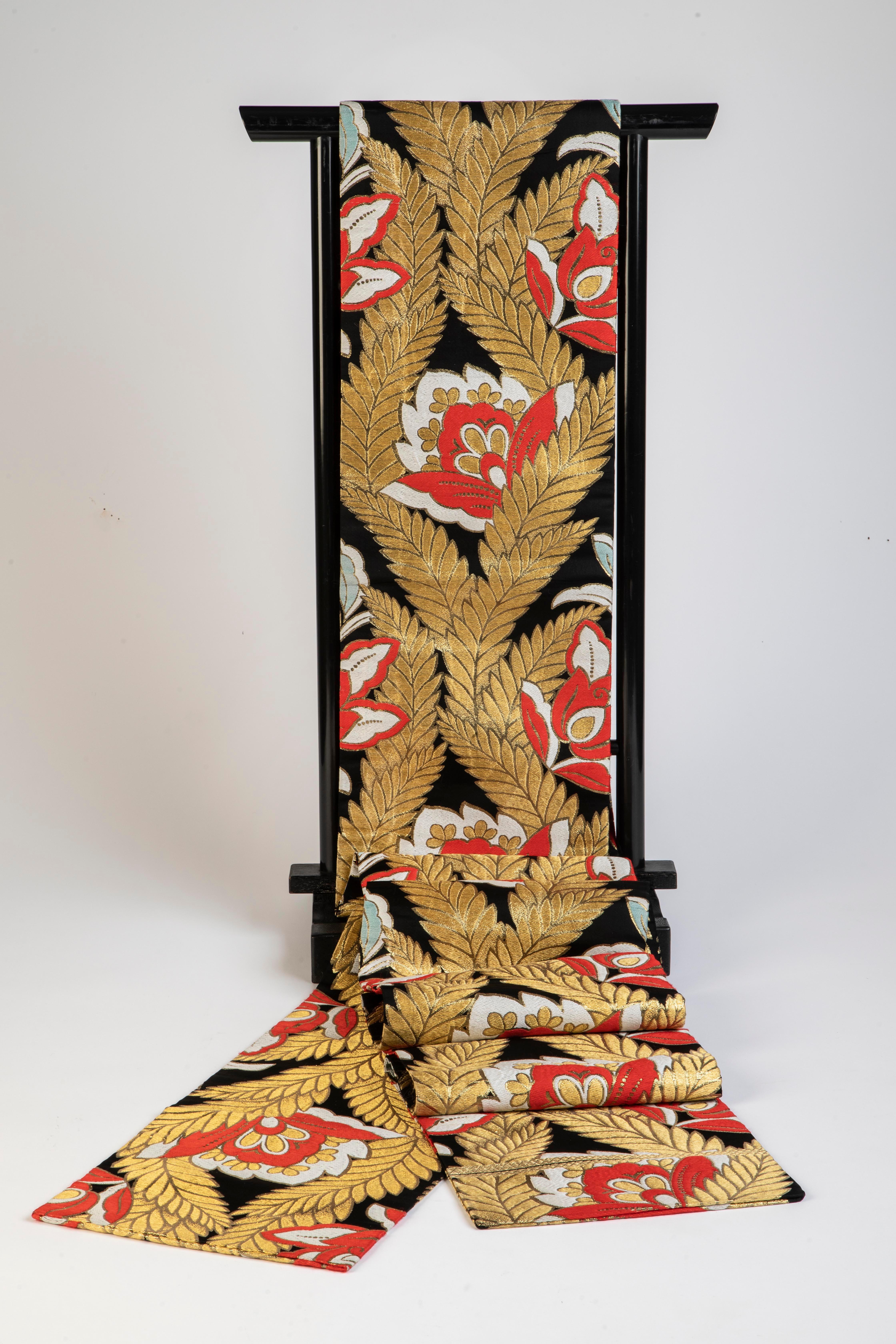 Festive red/black/gold/aqua silk Japanese Obi for the Holidays or anytime.
Great as accent table runner or hanging wall art.
Good condition.
1940/50
Finished on both sides.
Measurements (of textile item):
 154