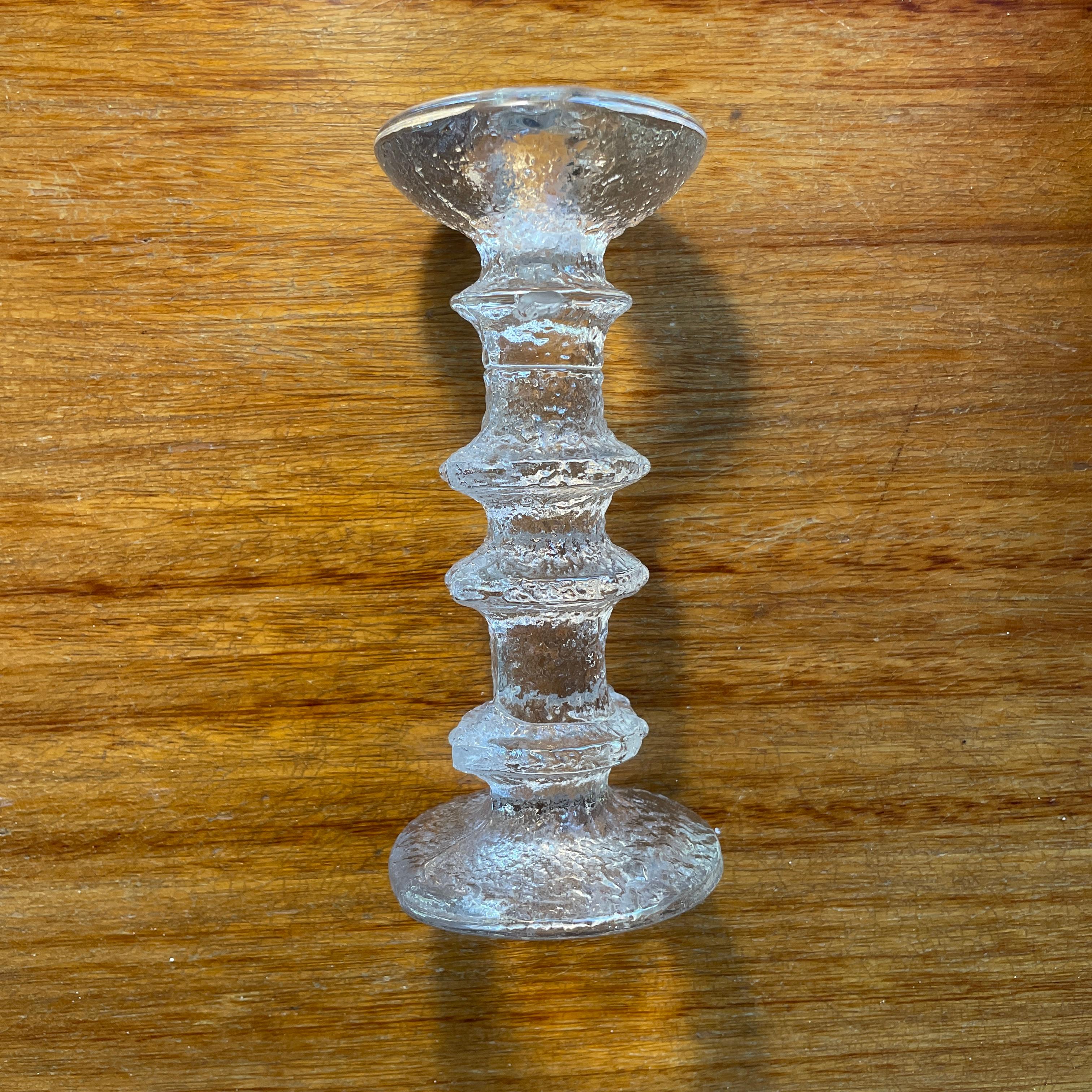 Festivo candleholders were designed by Timo Sarpaneva for Iittala in 1966. The striking glass objects feature an ice-like, textured design and come in various heights.

- Height 18cm
- Signed 