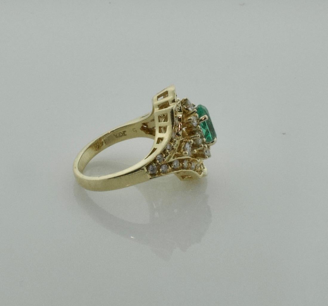 Oval Cut Fetching Emerald and Diamond Ring in Yellow Gold Emerald 1.35, Diamonds .90 For Sale
