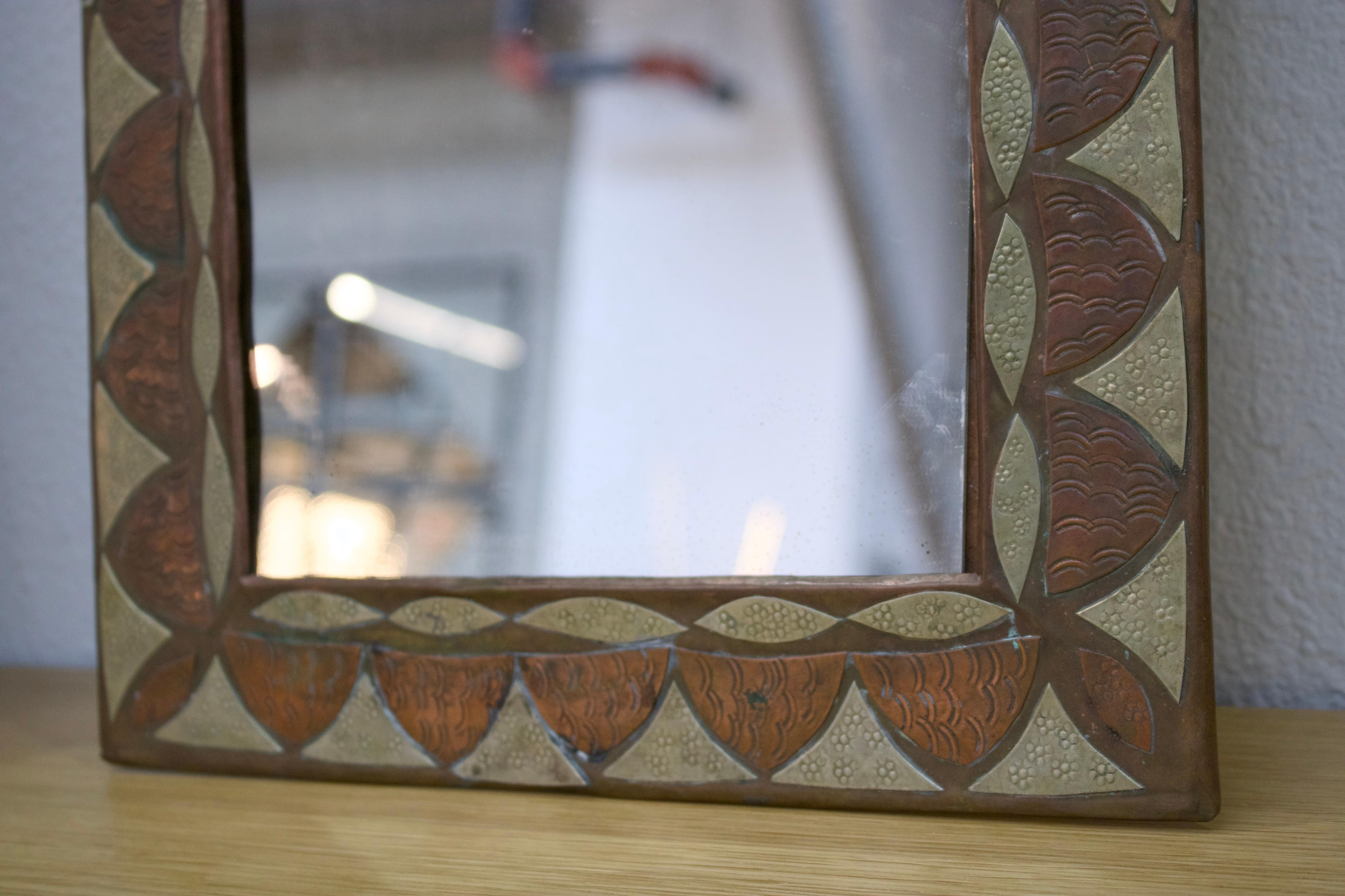 French “Feuille” arched brass and copper mirror For Sale