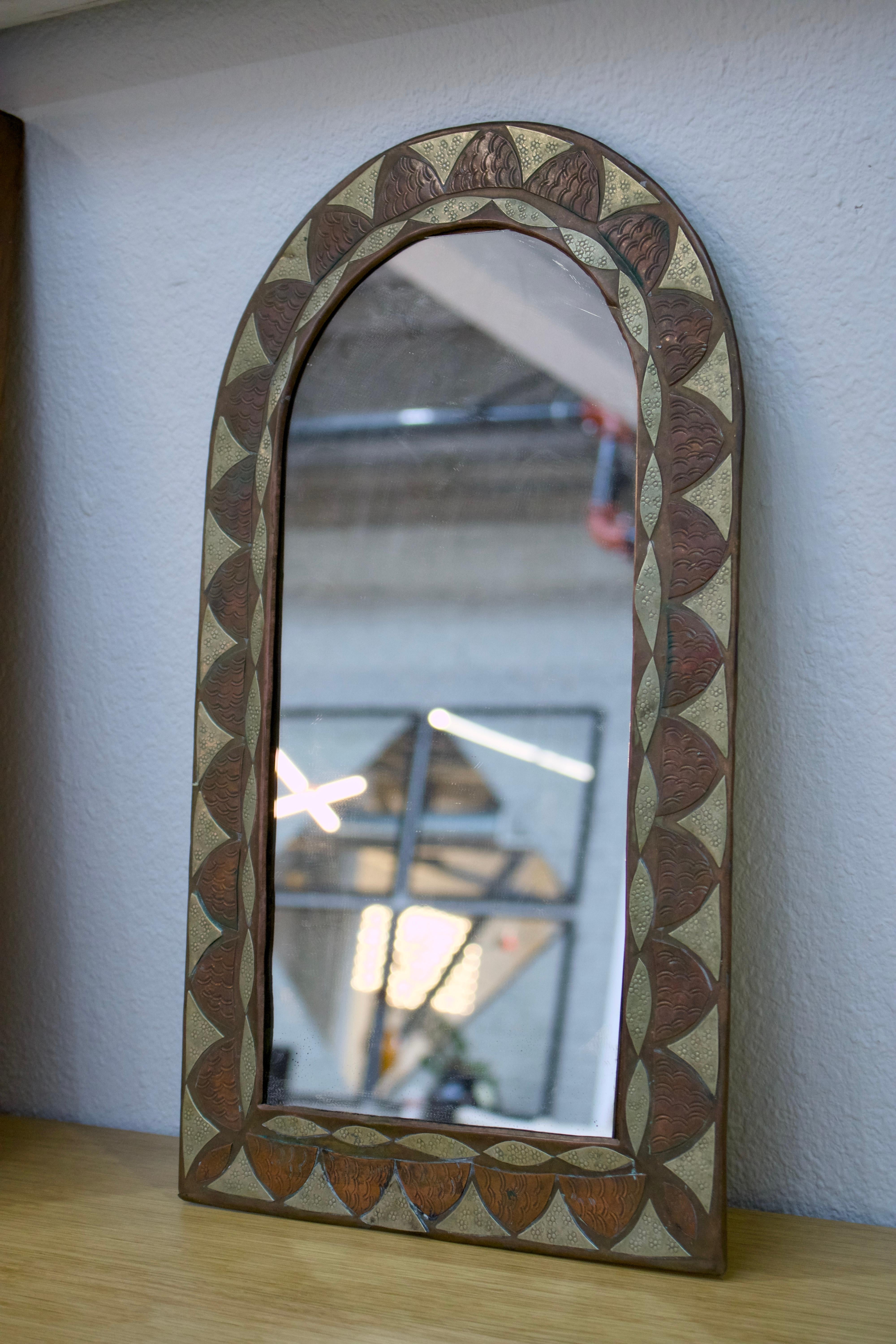 Embossed “Feuille” arched brass and copper mirror For Sale