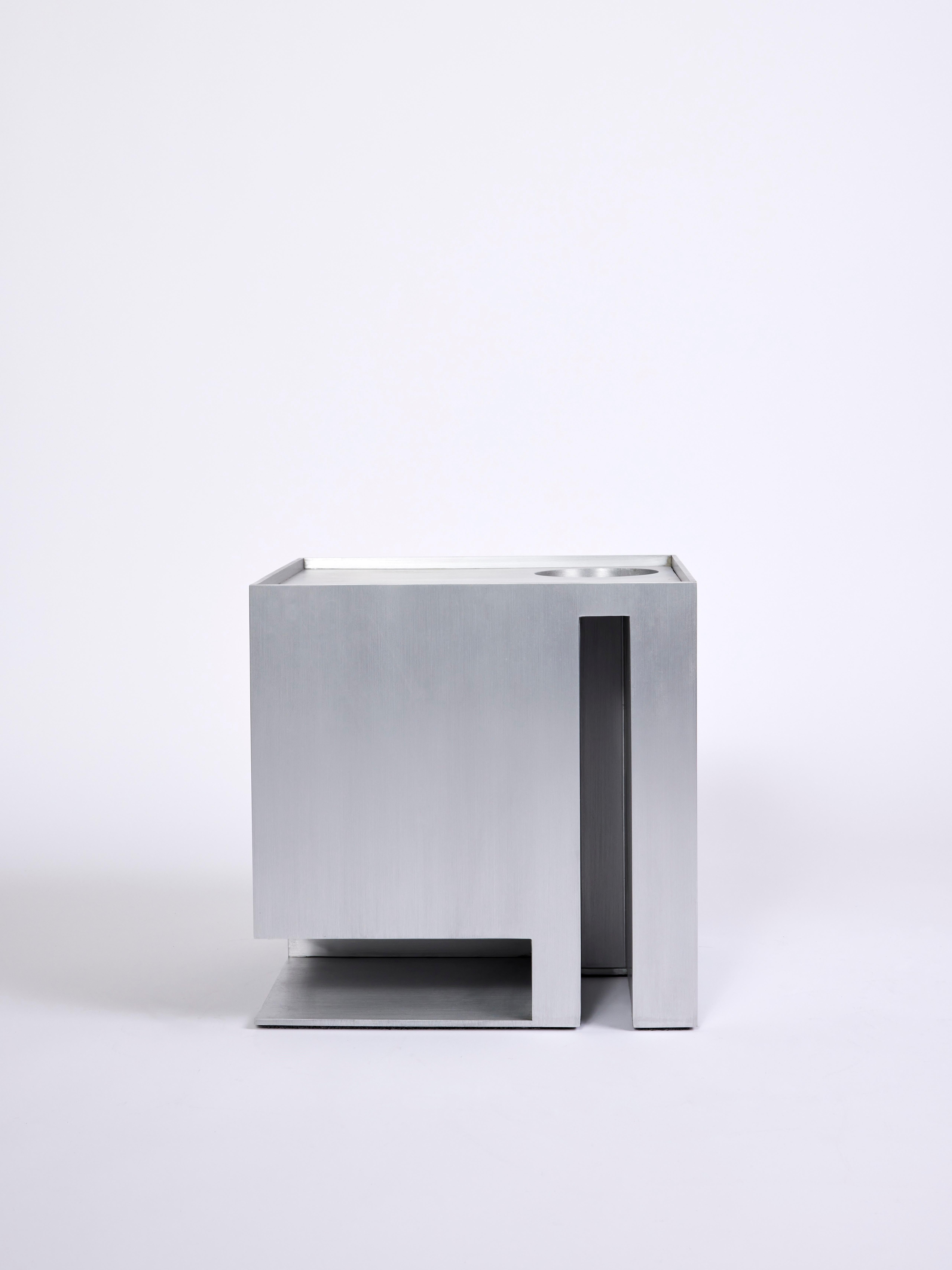 Dwell Side Table

Materials: hand brushed aluminum with clear coating
Dimensions: W16 x D16 x H16 inches

Dwell side table is inspired by the exterior of a boxy model home. Different geometric forms like circles and lines create negative spaces on