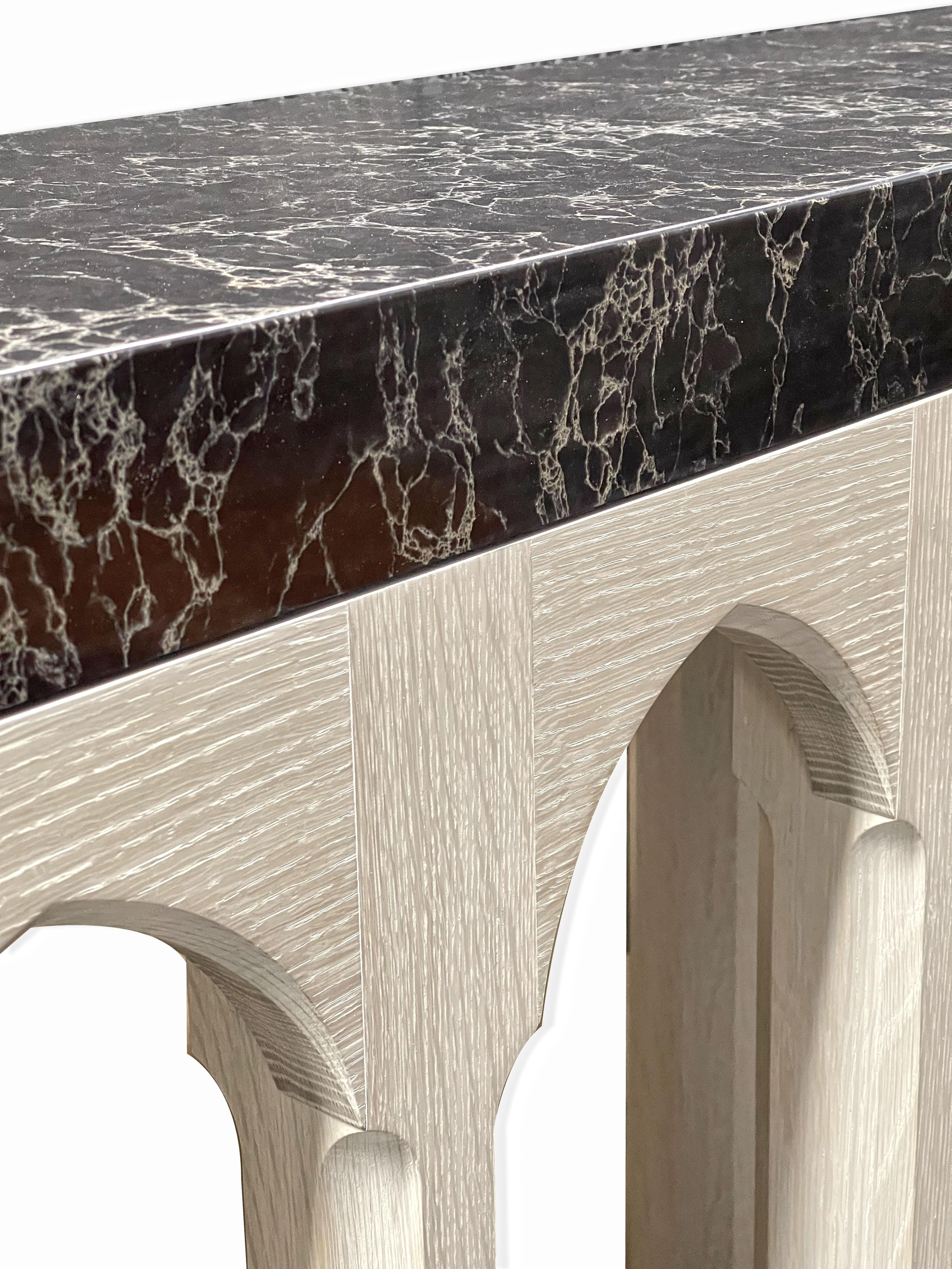 Inspired by traditional Moroccan Architecture this solid wood and stone console makes a commanding presence to any room.

wood: bleached oak
caesarstone: piatra gray
feet: ebony
