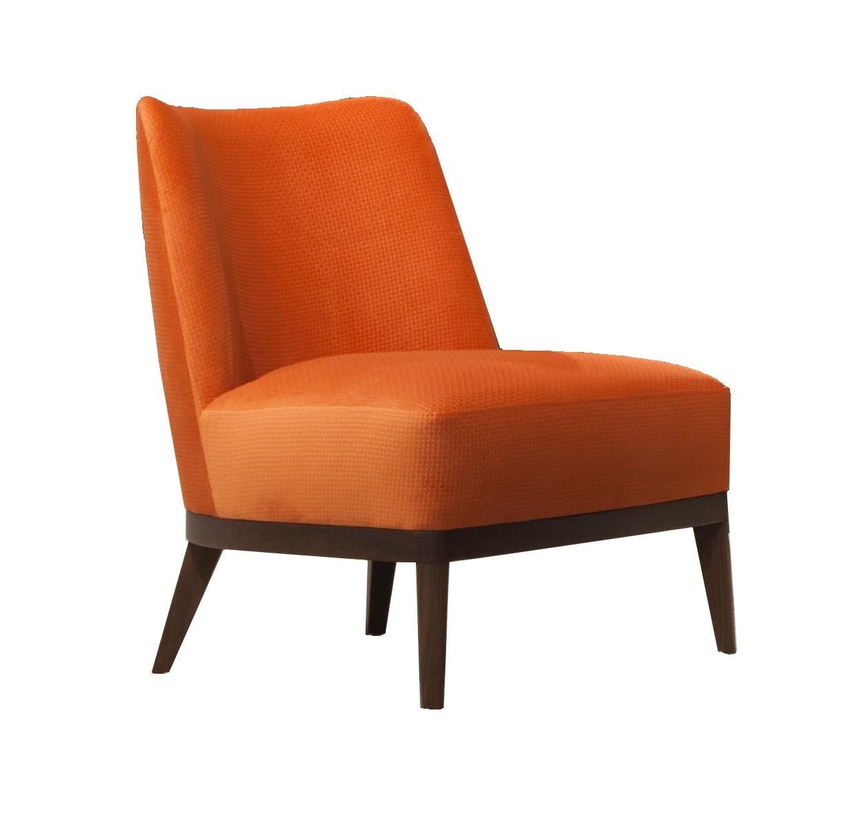 The Fez lounge chair II’s solid wood frame is combined with upholstered soft edges.