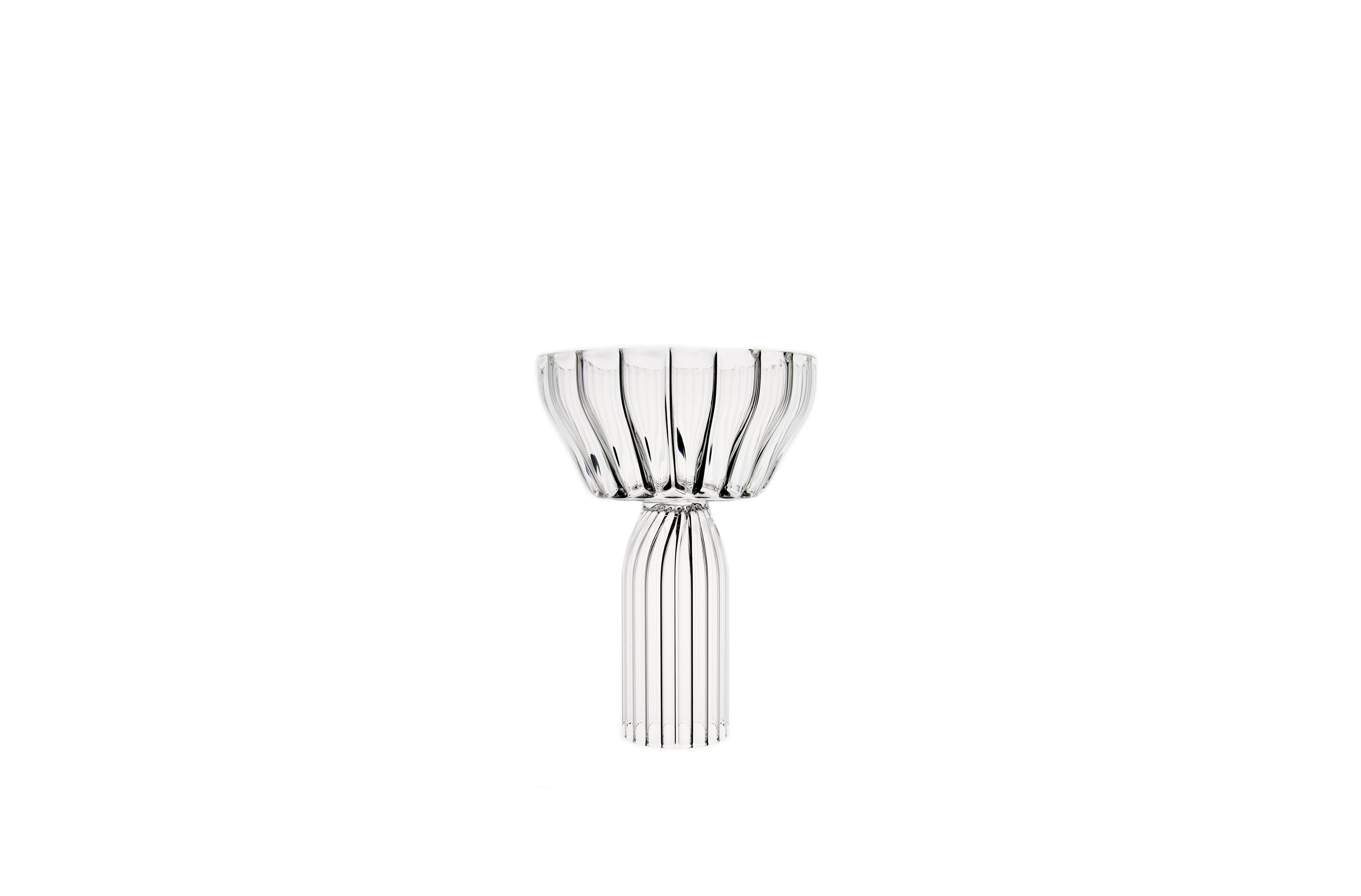 Margot Champagne Coupe is the ideal toasting glass for someone who loves generous details in their table setting. 

The Margot, a maximalist collection expressed through the introduction of fluted borosilicate glass with generous proportions was