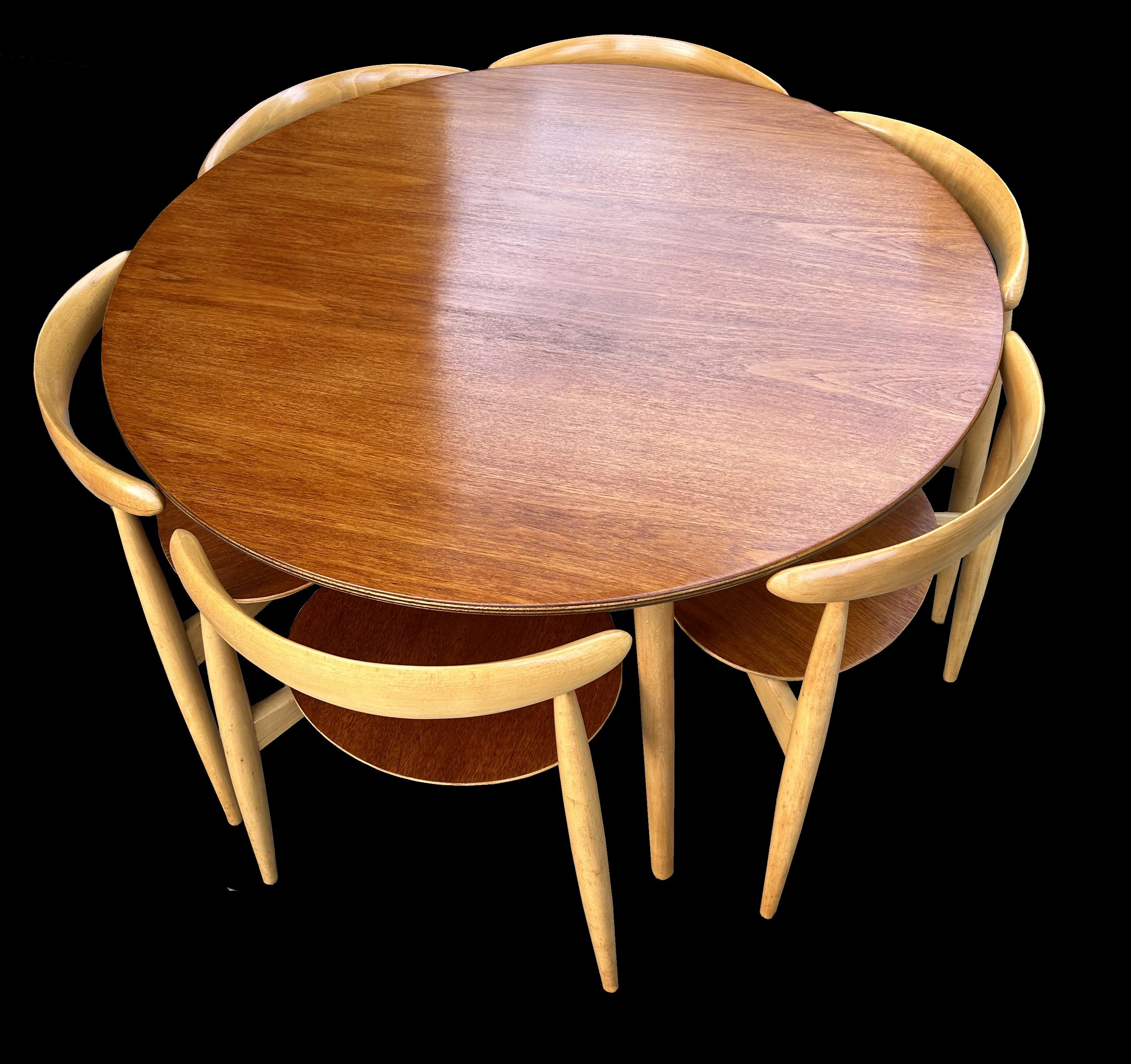 A beautiful classic Wegner dining suite consisting of six 'Heart' three legged chairs and matching table. The whole suite bought together in 1964 and have been together ever since.
We have been over this set and gently cleaned and waxed every piece