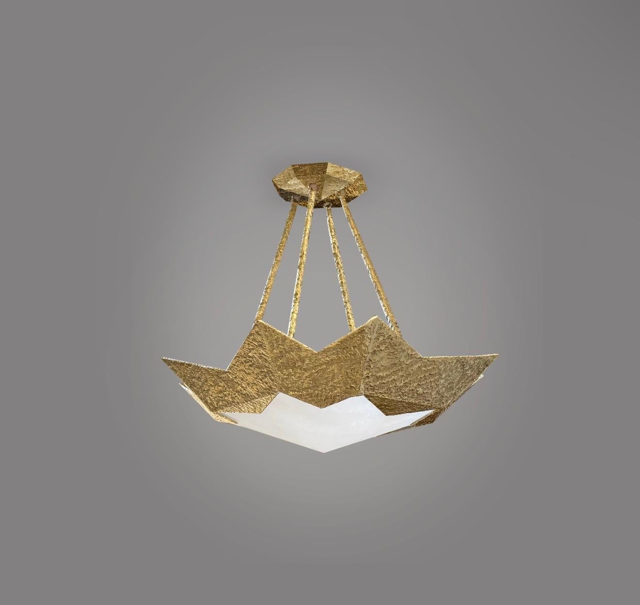 Finely carved rock crystal with hammered brass frame,created by Phoenix.

Custom size and metal finishes upon request.