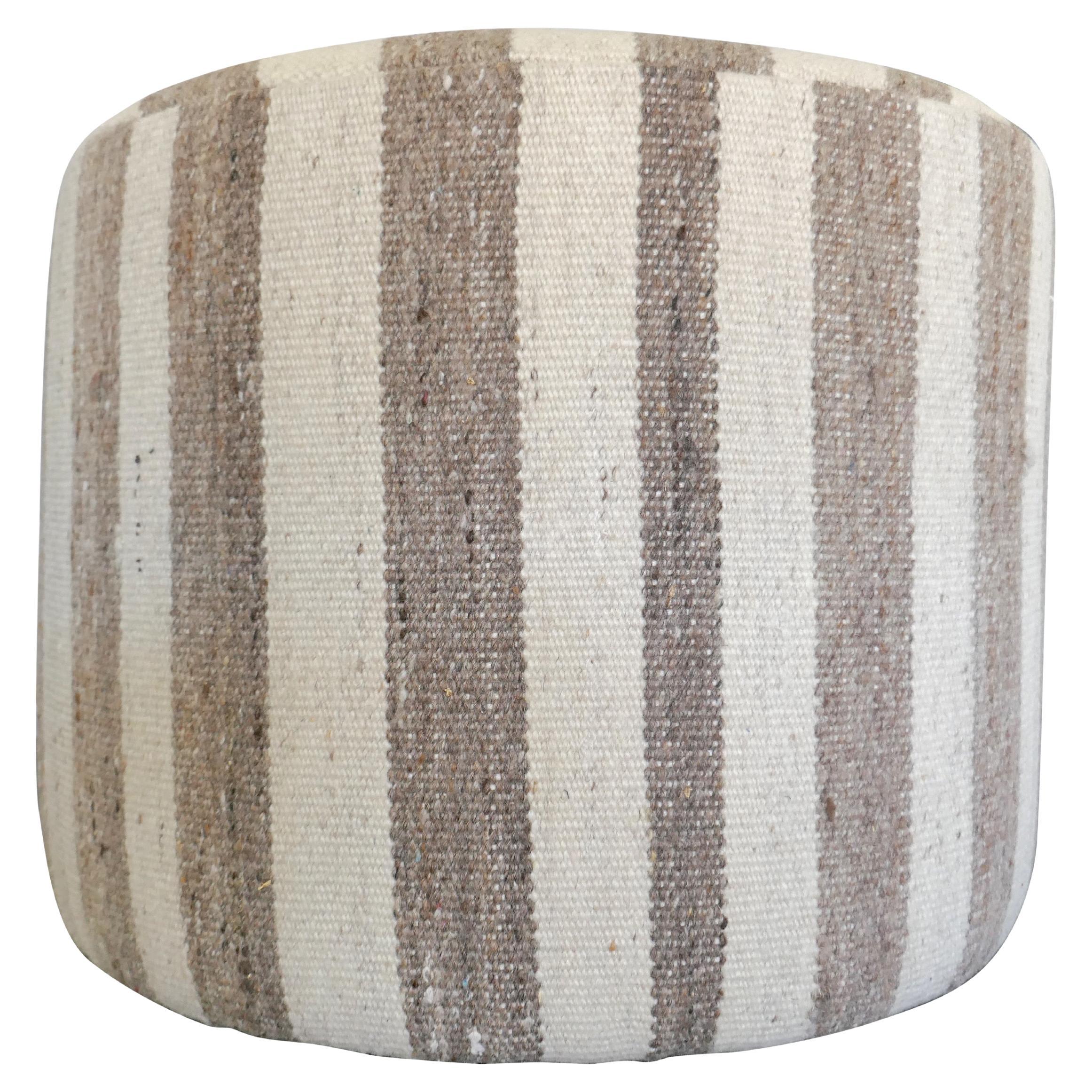 One-of-a-Kind!
FI custom cylinder style accent ottoman. Perfectly upholstered in fabulous authentic vintage hand-woven heavy textural Berber Kilim pure wool in beautiful variegated natural muted and earthy tone's. Featuring the original offset