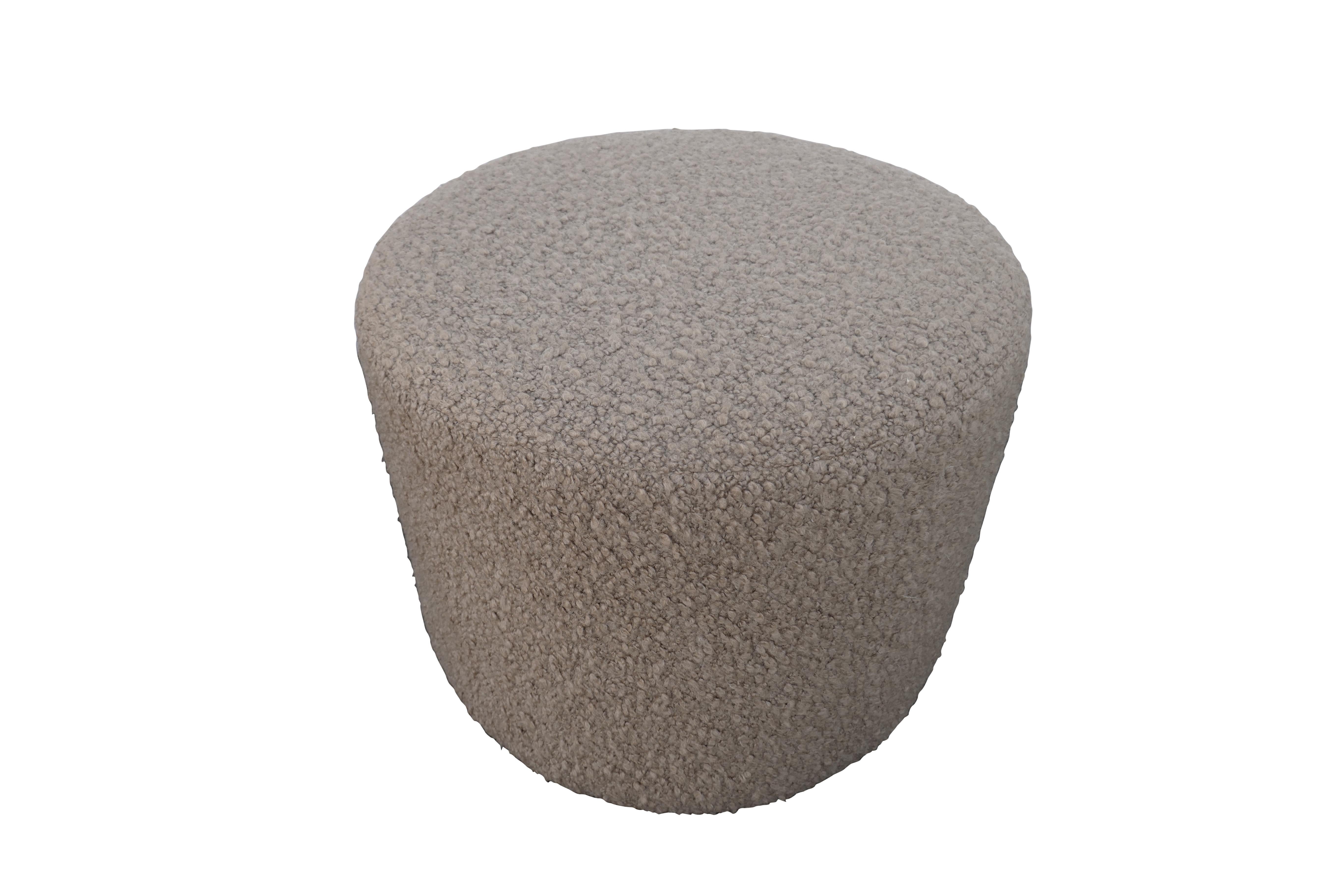 FI custom individually handcrafted cylinder style ottoman. As versatile as it is chic and luxurious. Created from ultra-luxe silky soft textural shearling textile, shown in Camel color way. Fully cushioned, solid wood inner-frame, superb quality.