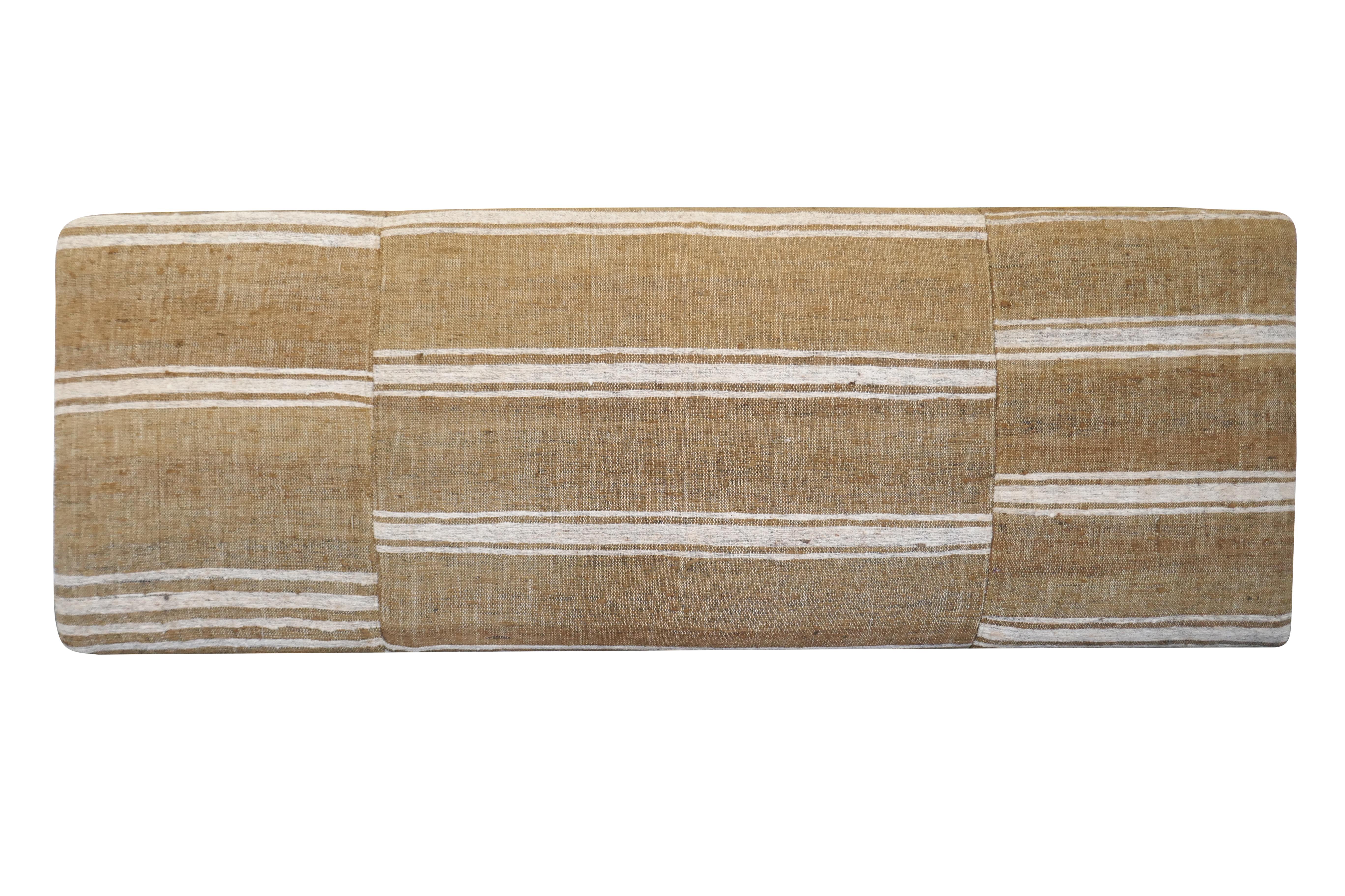 One-of-a-Kind!
FI custom large cocktail style ottoman. Perfectly upholstered in outstanding authentic vintage hand-woven heavy textural Berber Kilim pure wool in fabulous variegated camel & natural tones. Featuring original offset striping, a