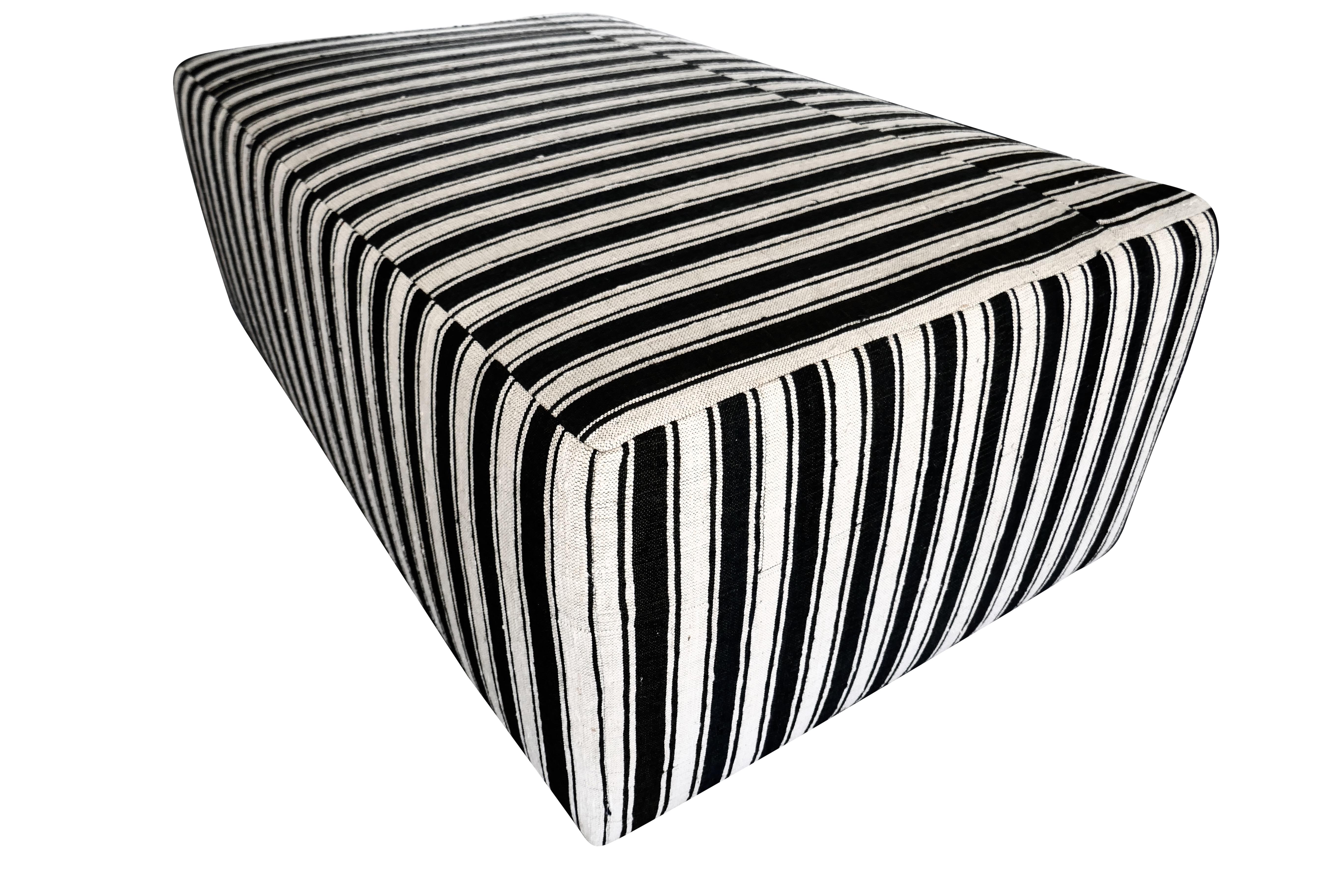 FI custom large cocktail ottoman, perfectly upholstered in beautiful authentic vintage hand-woven heavy textural Berber Kilim organic black & natural stripe wool textile. Fully cushioned with all soft edges and corners, solid wood inner-frame.