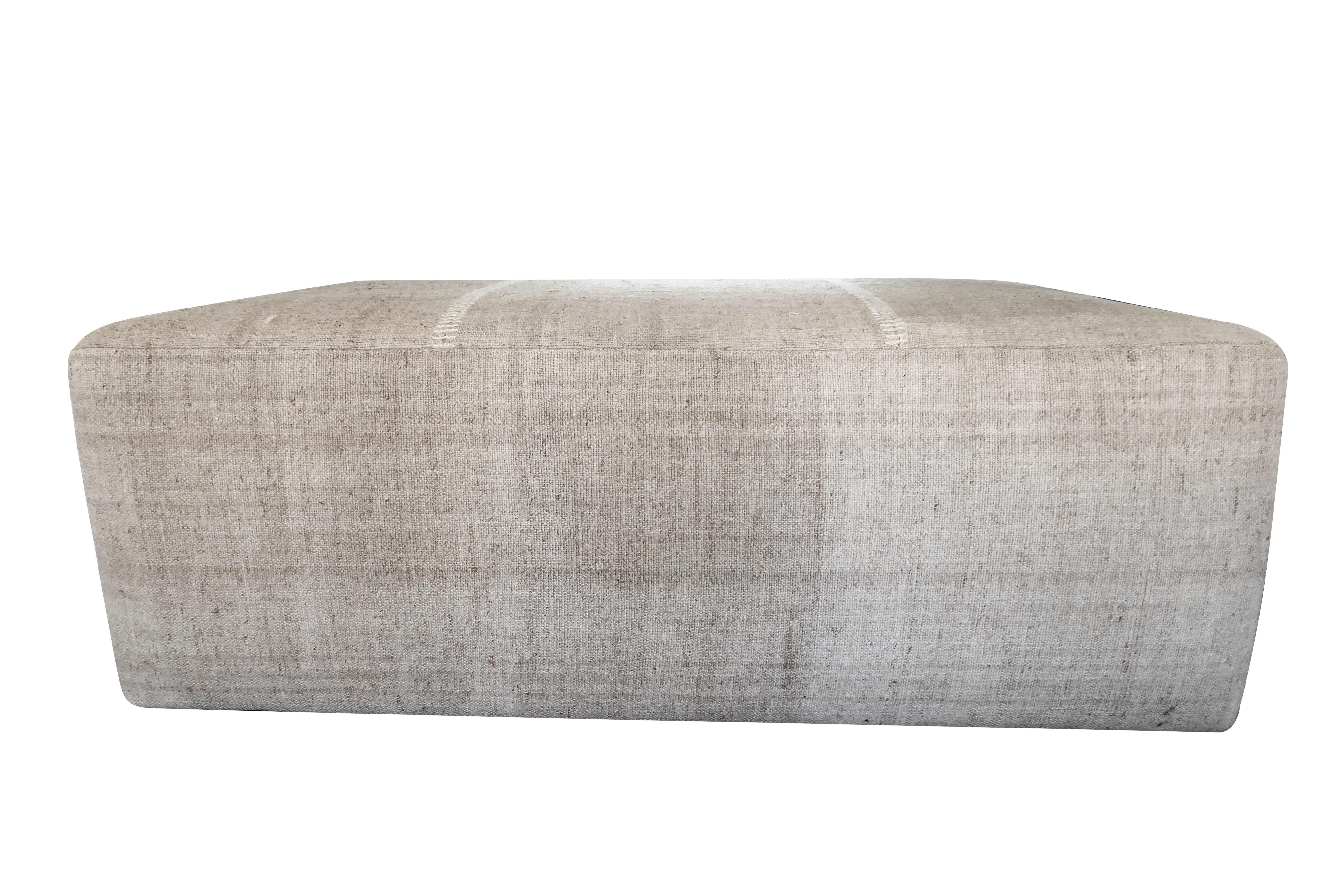 One-of-a-Kind!
FI custom large cocktail style ottoman. Perfectly upholstered in outstanding authentic vintage hand-woven heavy textural Berber tribal Kilim natural hand-spun hemp in beautiful variegated muted tones. Featuring the original hand