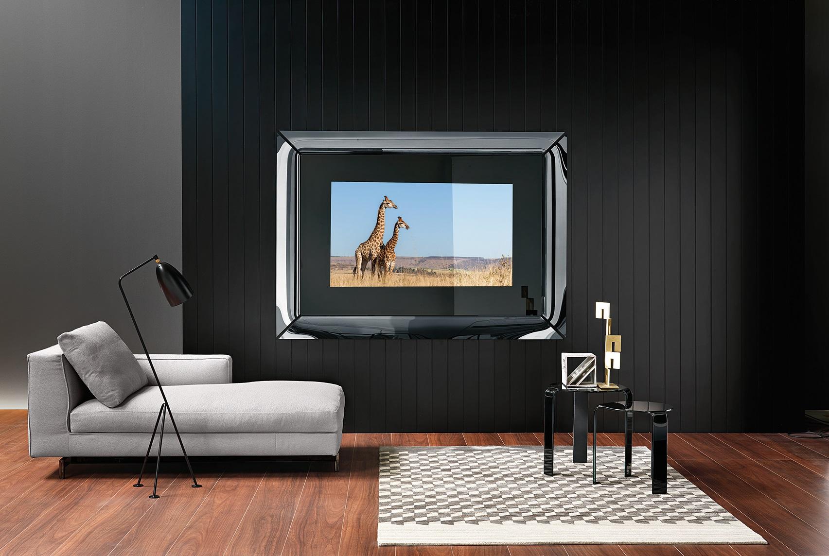 Mirror with integrated 65” television. Wall mirror in 5 mm-thick semi-reflective glass titanium finish including 4 single curved elements in 6 mm-thick semi-reflective black back-painted glass. Matt black painted metal rear frame.
  TV not included