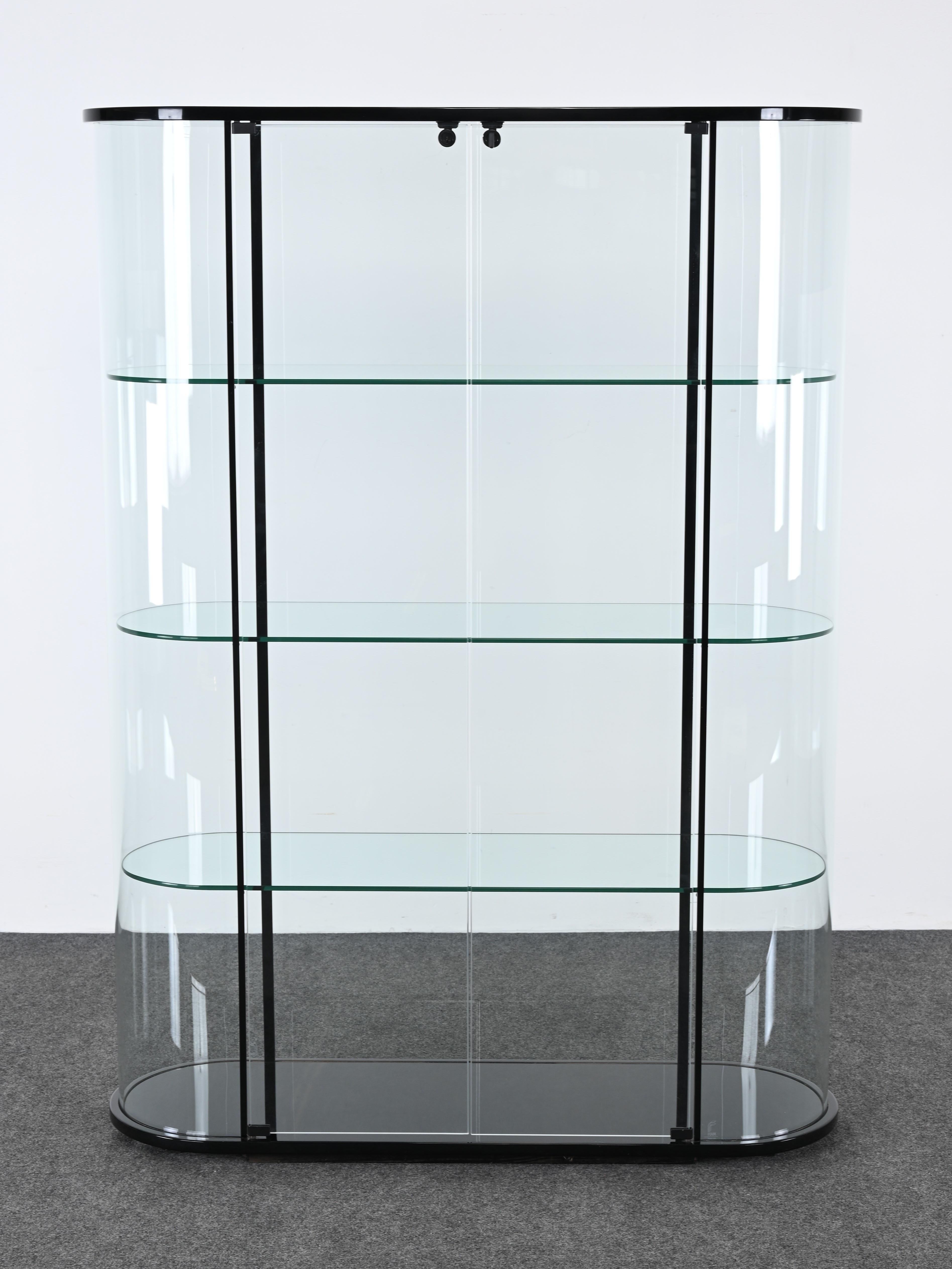 A modernist and functional display showcase by FIAM, Italy for the Palladio Collection.  The vitrine is a Modernist design. It has simple lines and showcases collections with ample storage. It would work in any interior and Modern home. The showcase