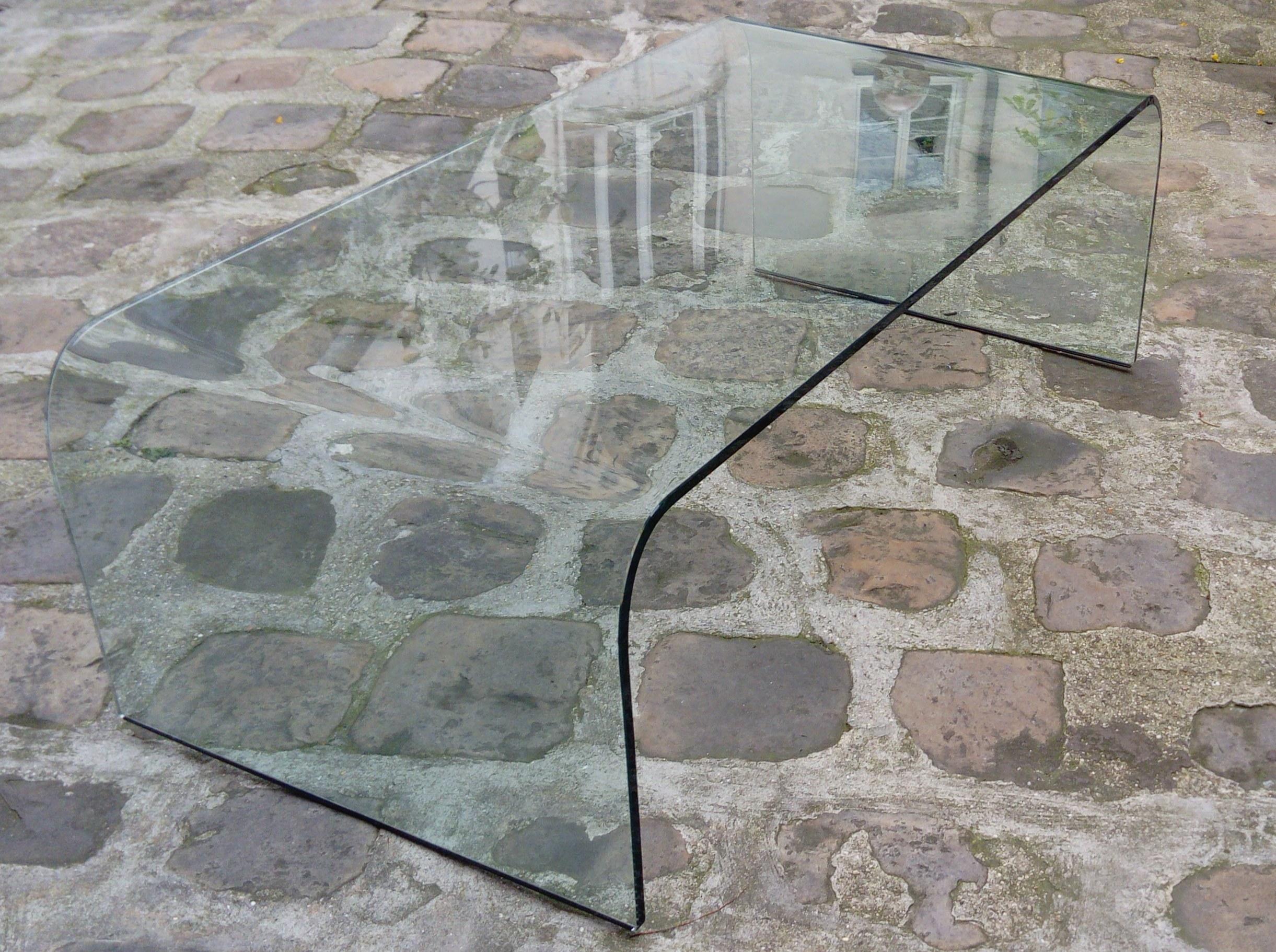 Fiam coffee table:

Vintage coffee table by Angelo Cortesi - Fiam Italy Edition, circa 1980
Material: Glass
Dimensions: L 120 x D 60 x H 40 cms
Signed FIAM ITALIA on one side of the glass.
Very good condition!