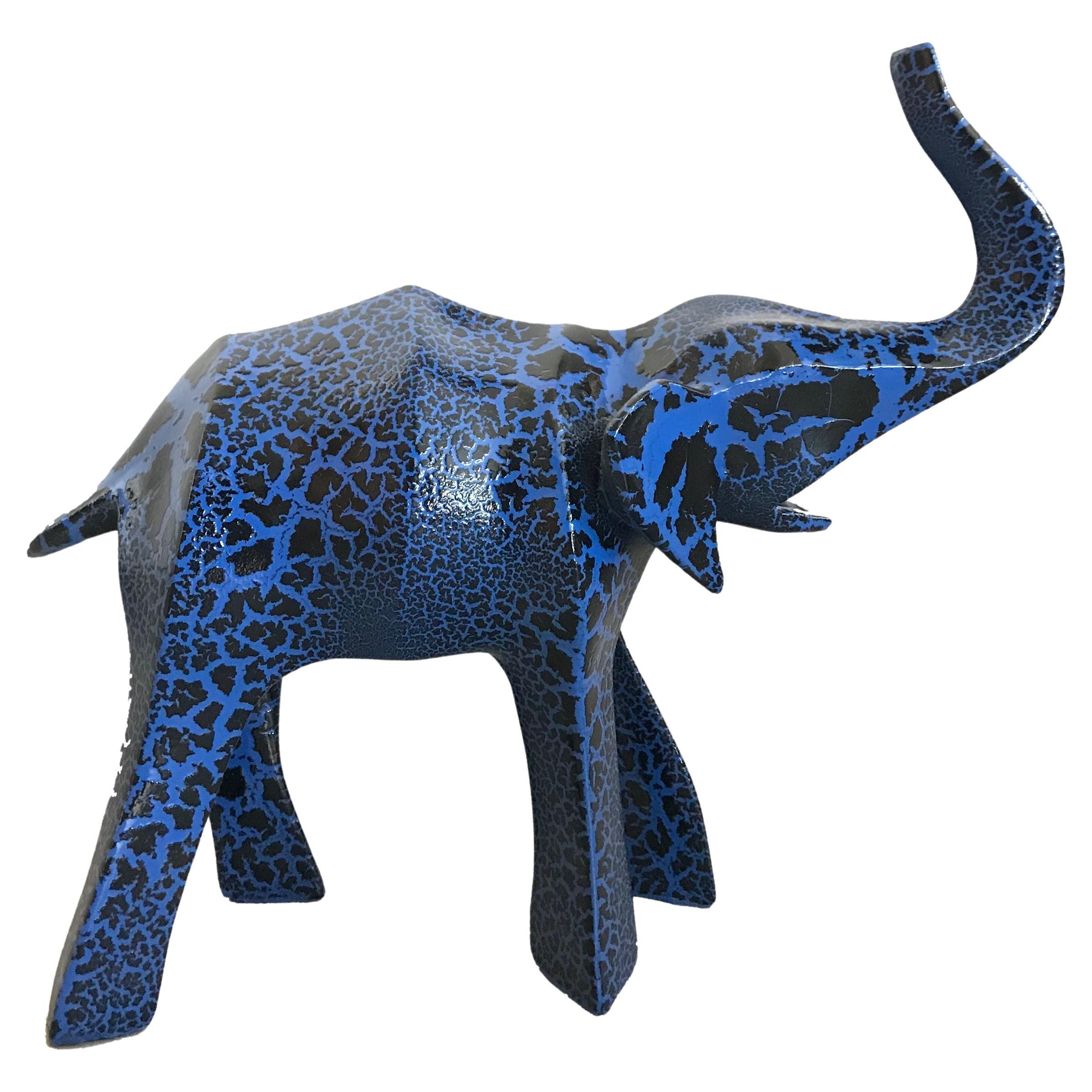 The Fiberglass Crackled Elephant Sculpture by Kunaal Kyhaan is part of a collection of sculptures that are inspired by Indian mythology and by exotic animals that are indigenous to India. 
Each animal is hand cast and reinterpreted into
