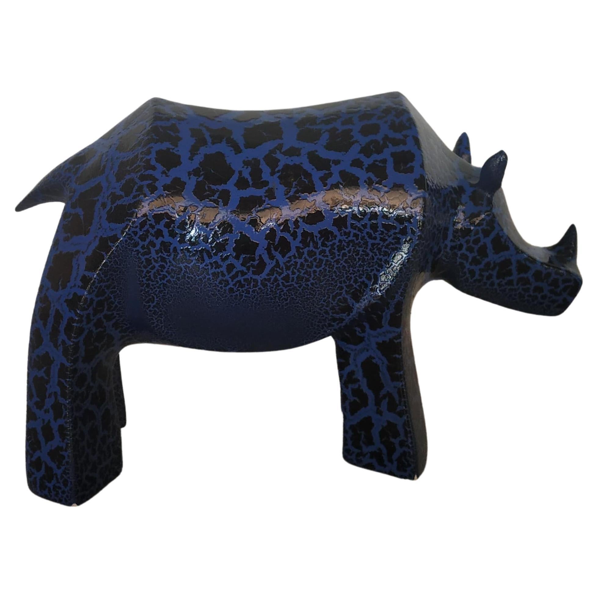 The Fiberglass crackled Rhino Sculpture by Kunaal Kyhaan is part of a collection of sculptures that are inspired by Indian mythology and by exotic animals that are indigenous to India. 
Each animal is hand cast and reinterpreted into