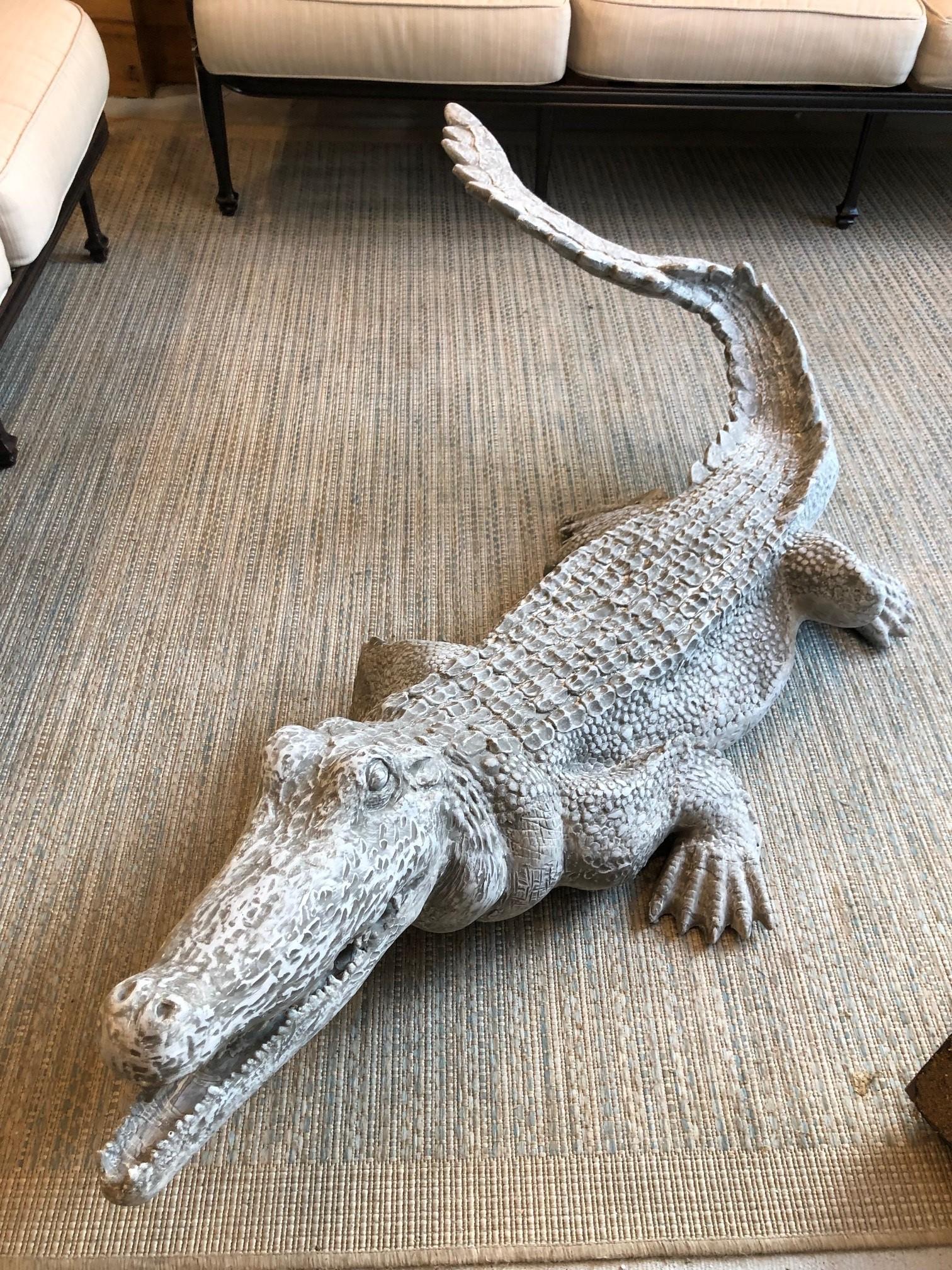 Fiberglass American Alligator made of a very durable fiberglass which would look great in any backyard or patio. You can also paint it to look more like a real crocodile or leave it a natural gray. I have many customers who place them by a pool and