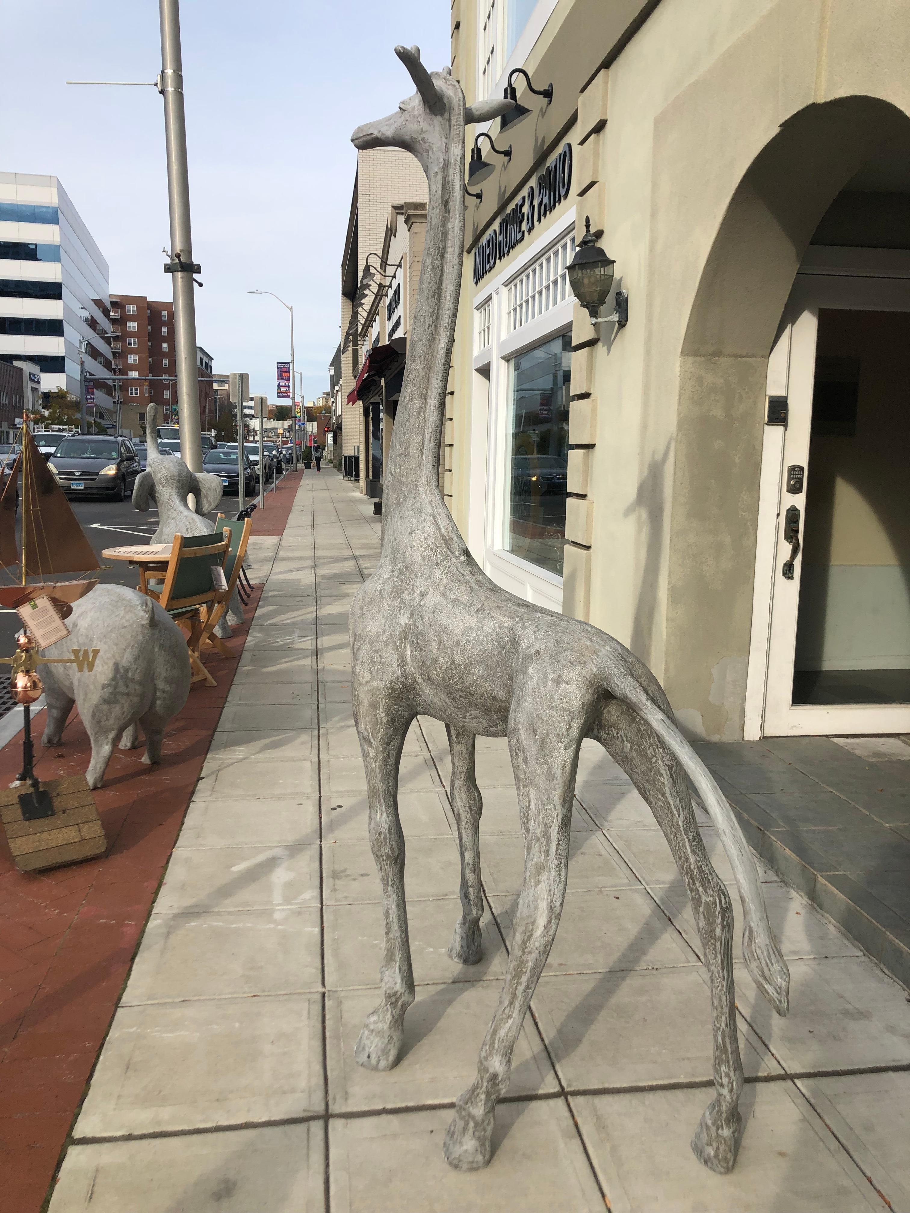concrete giraffe statue