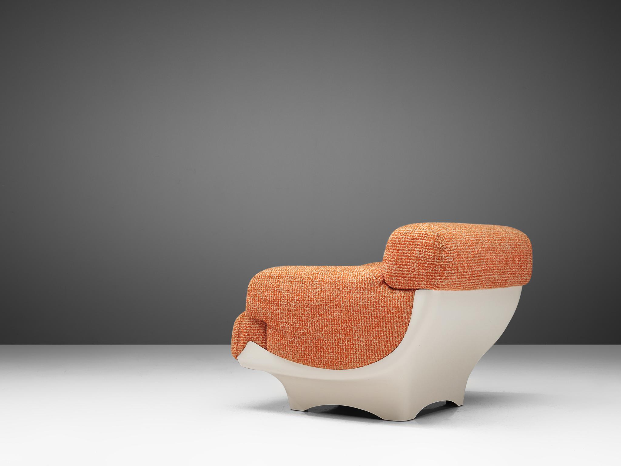 Lounge chair in fiberglass and original fabric upholstery, France, 1970s. 

This highly comfortable lounge chair has a very soft and inviting appearance. The textured orange and beige fabric contrasts nicely with the white fiberglass shell. Due to