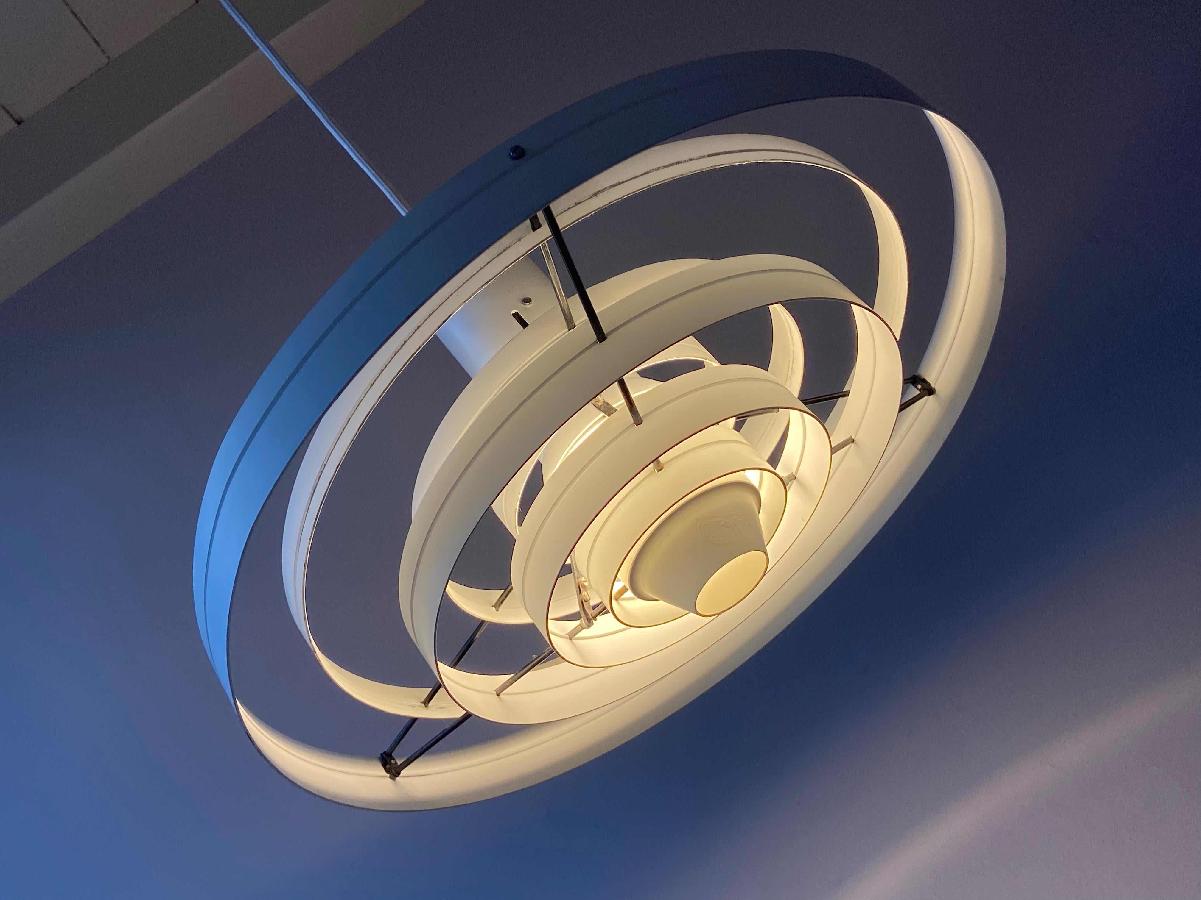 Very nice white metal Fibonacci pendant lamp by pendant lamp by Sophus Frandsen for Fog & Mørup, Denmark. With the original company sticker no parts missing.
New wirering and E26/27 Edison socket so ready to use world wide.

