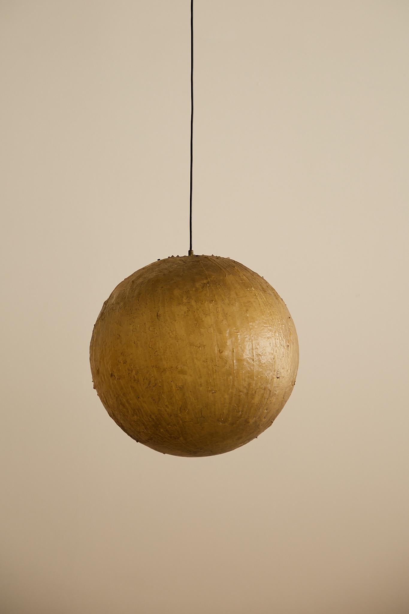 Italian fibreglass ceiling light, likely from the 1970s. Featuring a softly diffused glow and a sculptural form, this piece combines lightweight construction with a warm, ambient presence.