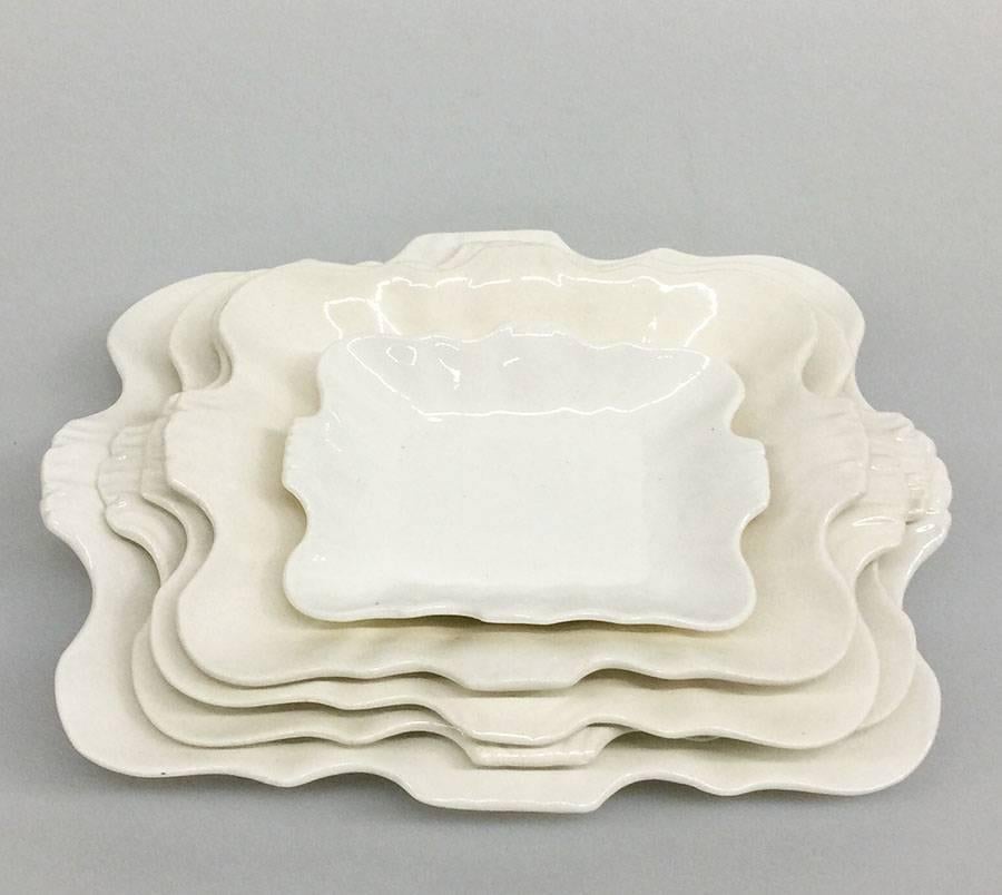 English 18th Century Cream Ware Wedgwood nesting Serving Dishes

5 pieces of 18th Century English Cream ware Wedgwood serving dishes
The serving dishes are hand-formed, as shown by the shape of the dishes
1 serving dish has a small baking error on