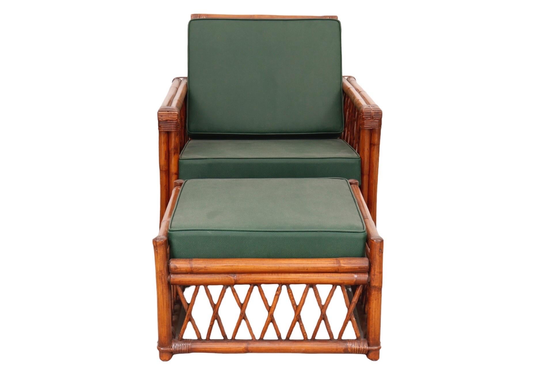 A Bamboo lounge chair and ottoman made by Ficks Reed. The square frame in double bamboo is secured with rattan wrapping at the joins, sides are decorated with a diamond rattan lattice. Newly upholstered with high density foam cushions in a forest
